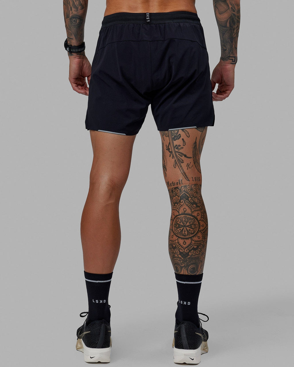 Man wearing UltraAir 5" Lined Performance Short - Black-Reflective