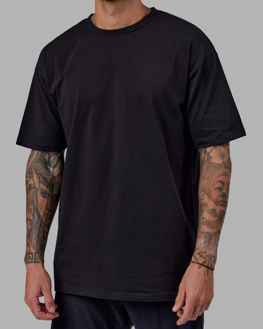 Man wearing Unisex Love The Run FLXCotton Tee Oversize - Black-White