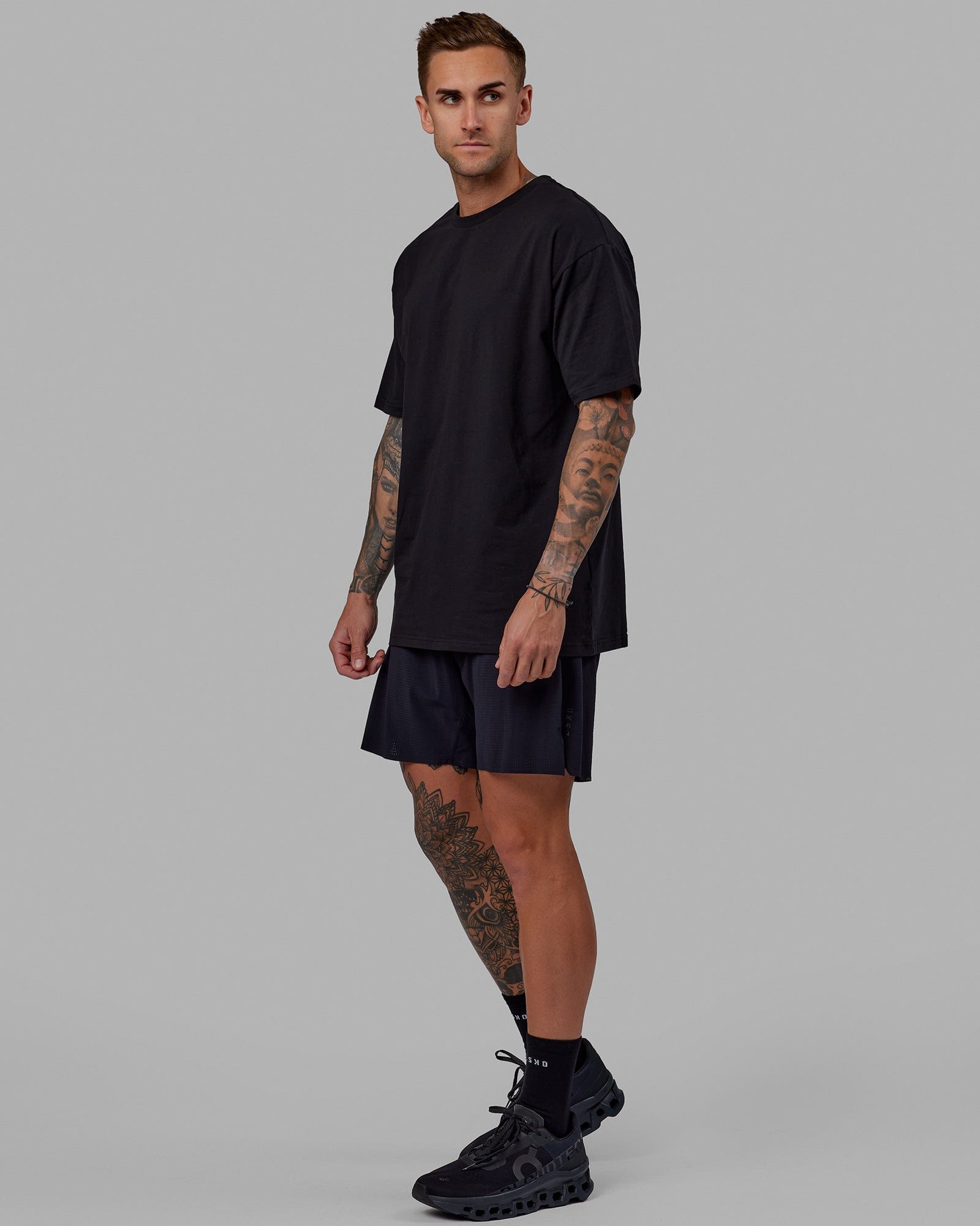 Man wearing Unisex Love The Run FLXCotton Tee Oversize - Black-White