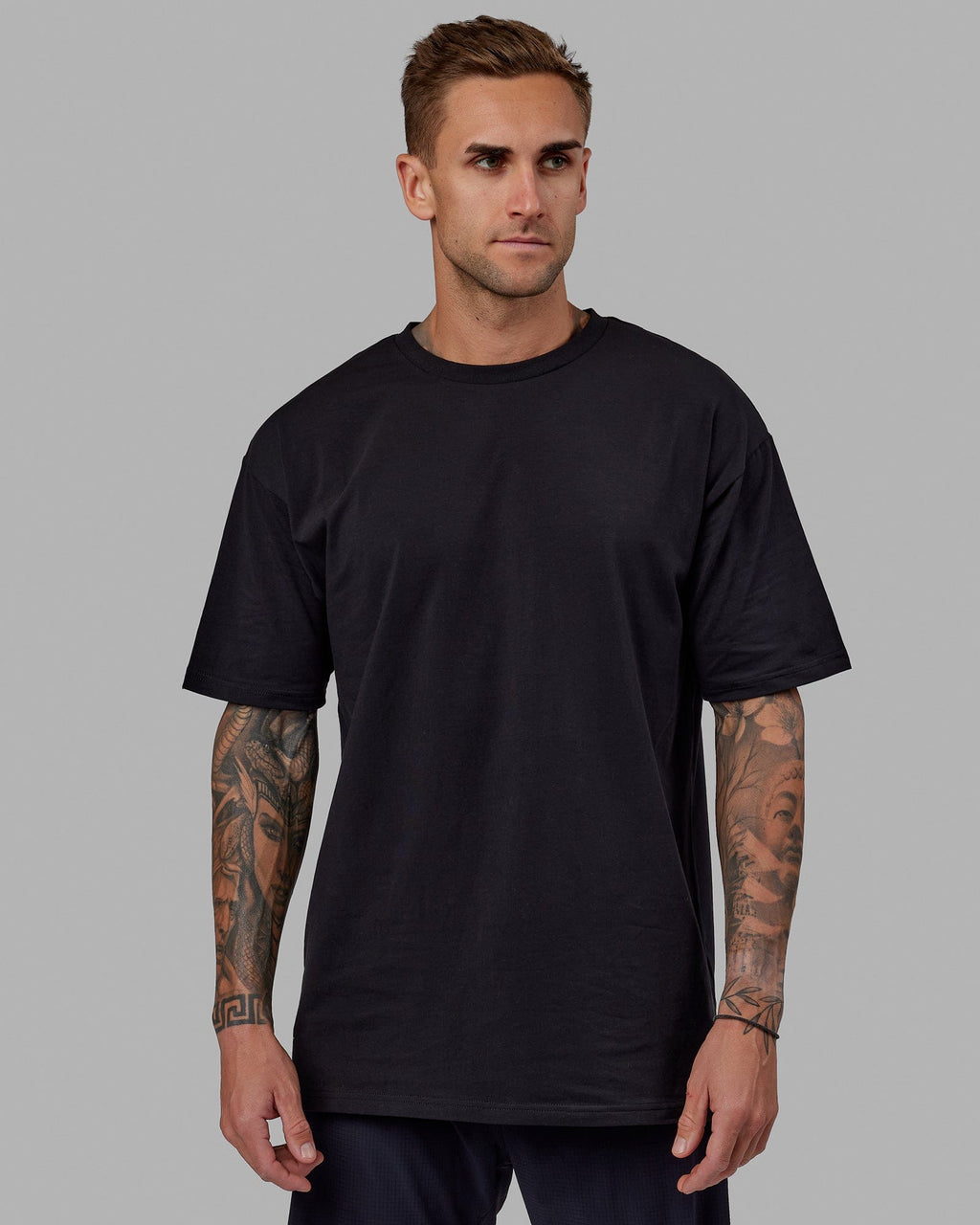 Man wearing Unisex Love The Run FLXCotton Tee Oversize - Black-White