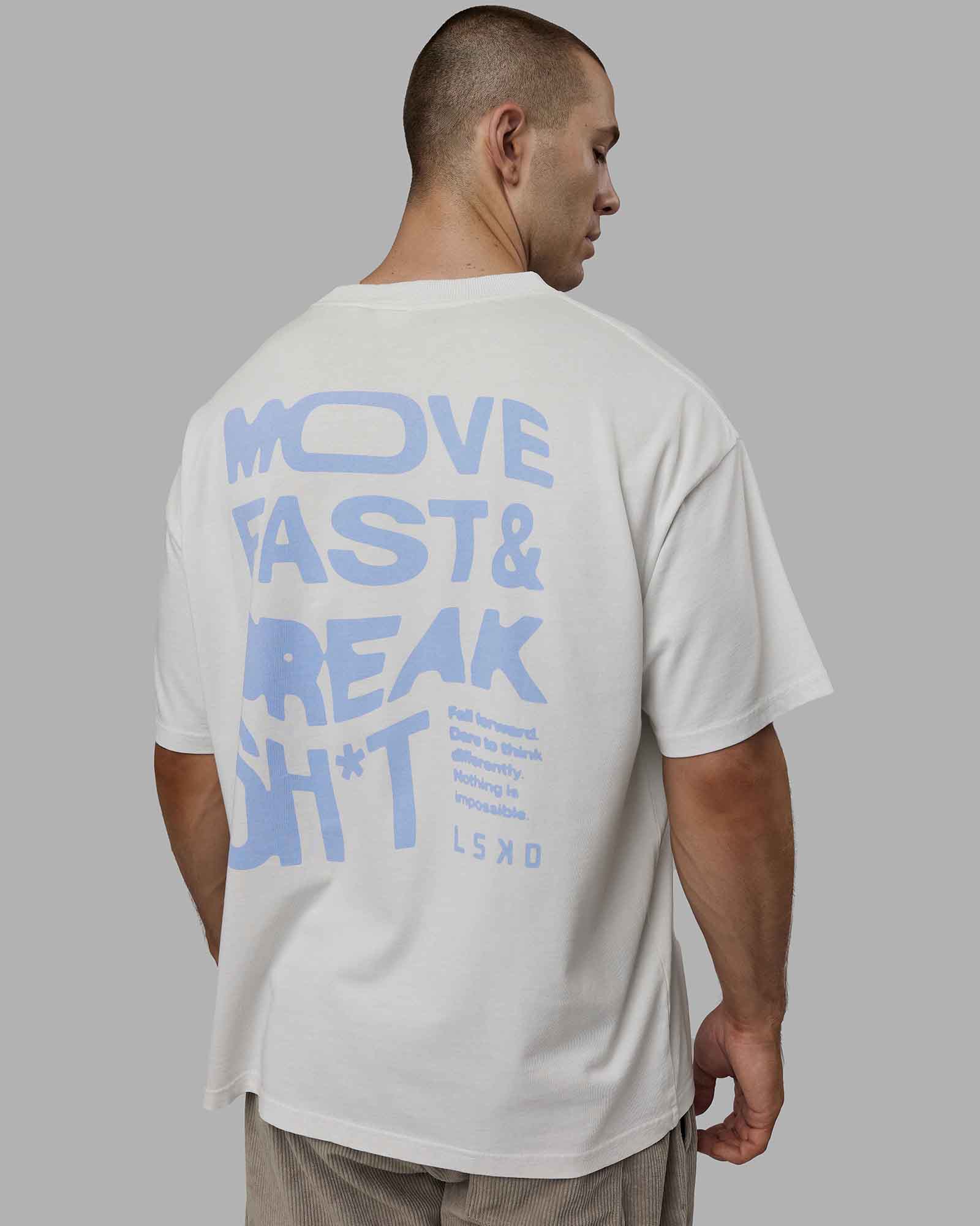 Man wearing Unisex Washed Move Fast Heavyweight Tee Oversize - Lunar Rock-Windsurfer