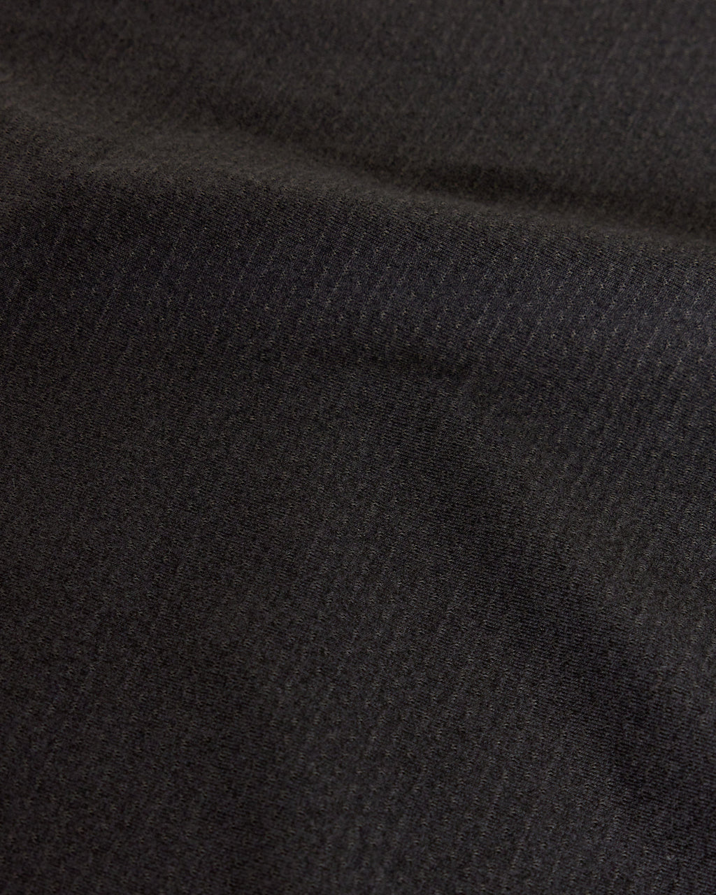 Woman wearing Perform VapourFLX Tee - Black Marl