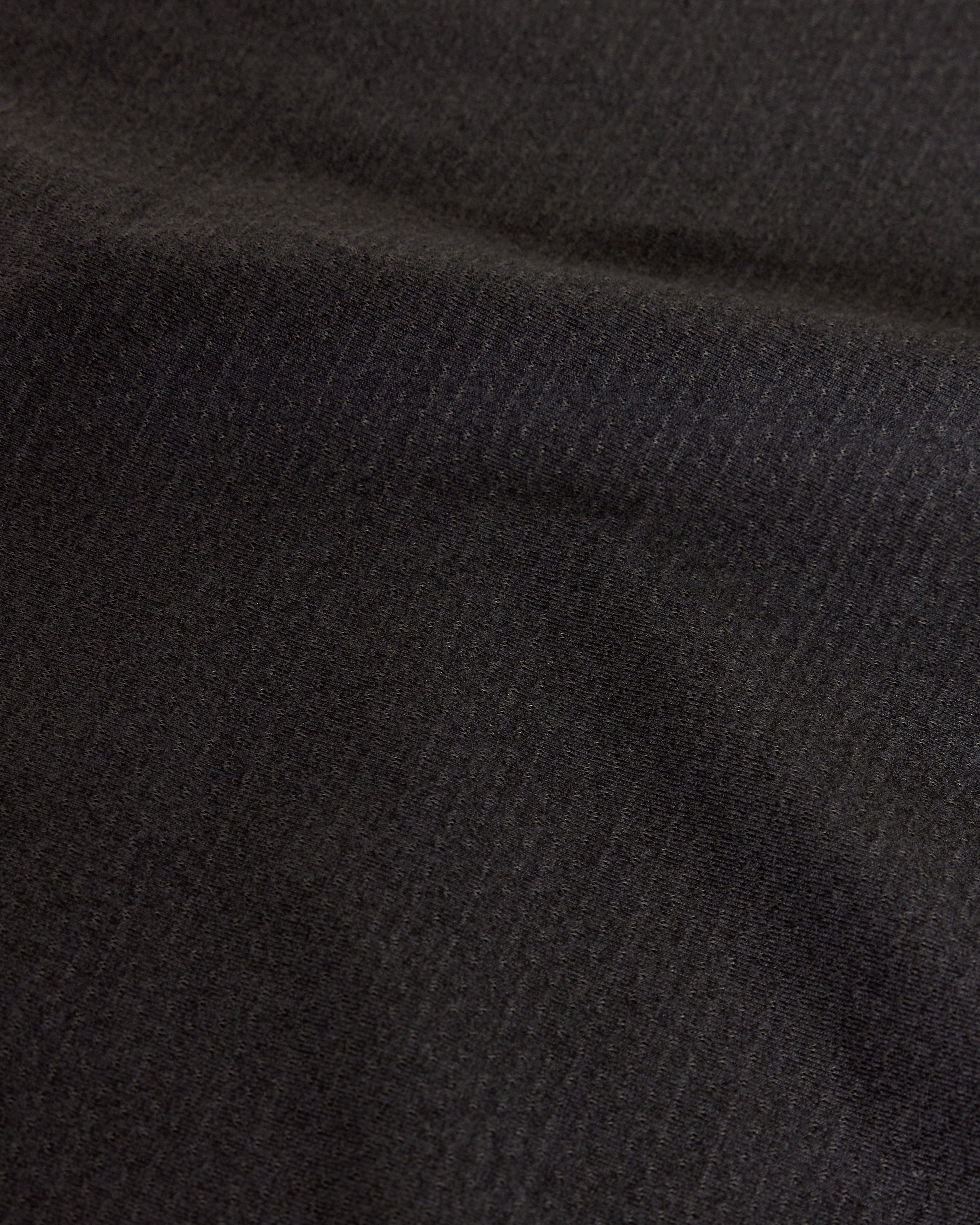 Woman wearing Perform VapourFLX Tee - Black Marl