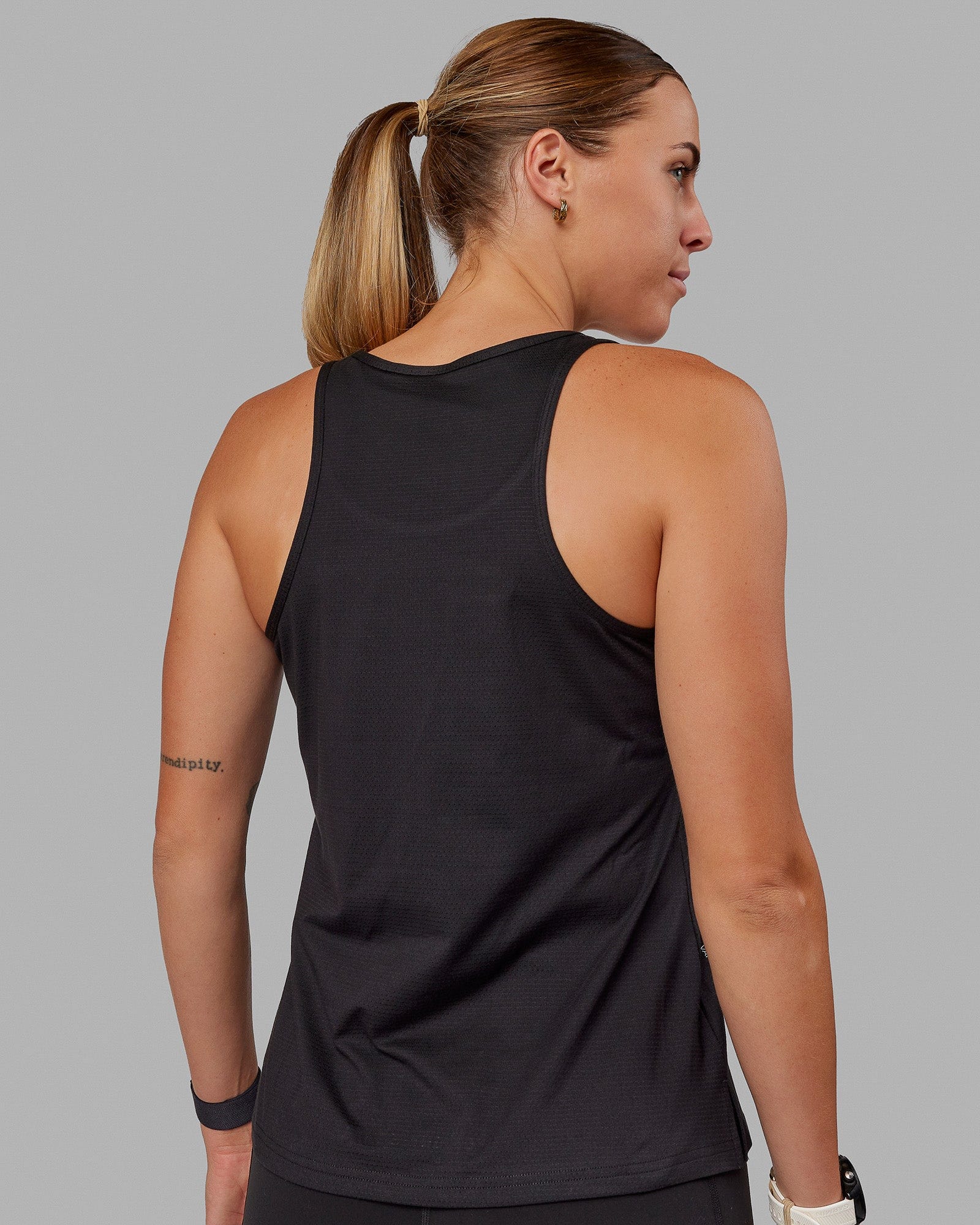 Woman wearing Perform VapourFLX Tank - Black
