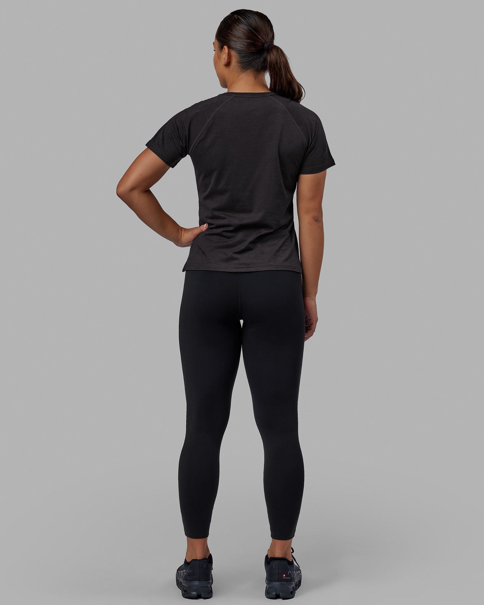 Woman wearing Perform VapourFLX Tee - Black