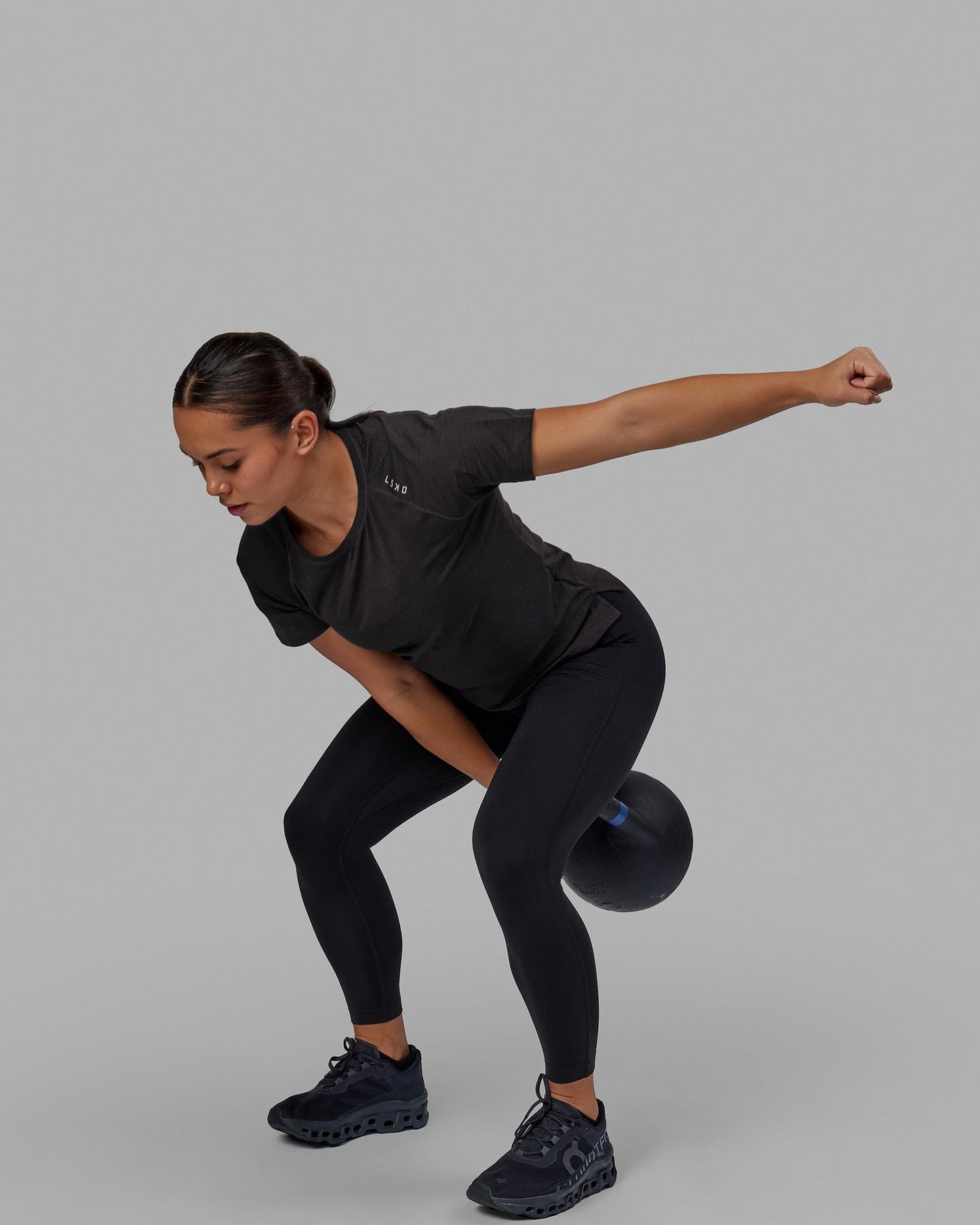 Woman wearing Perform VapourFLX Tee - Black