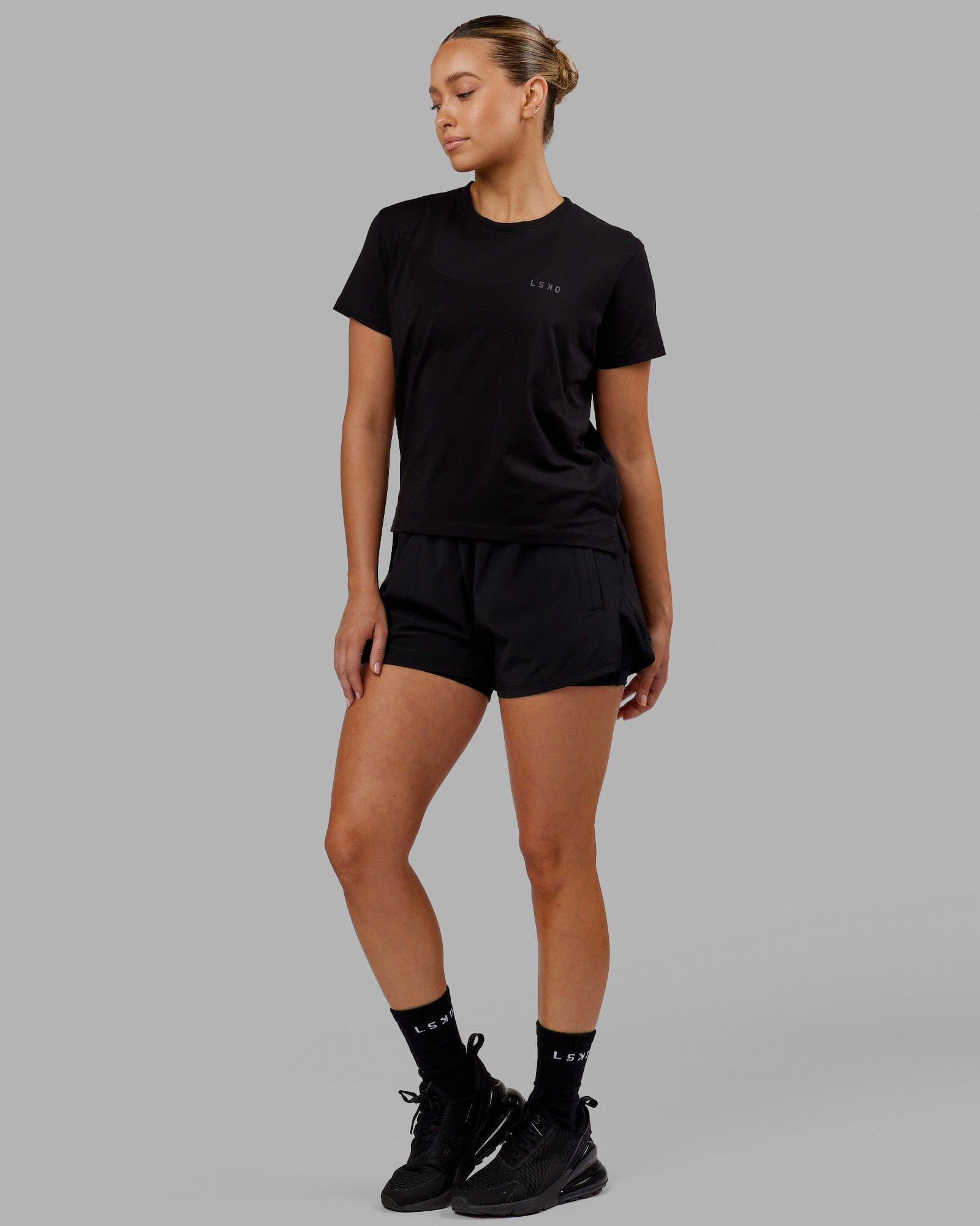 Woman wearing Deluxe PimaFLX Tee - Black