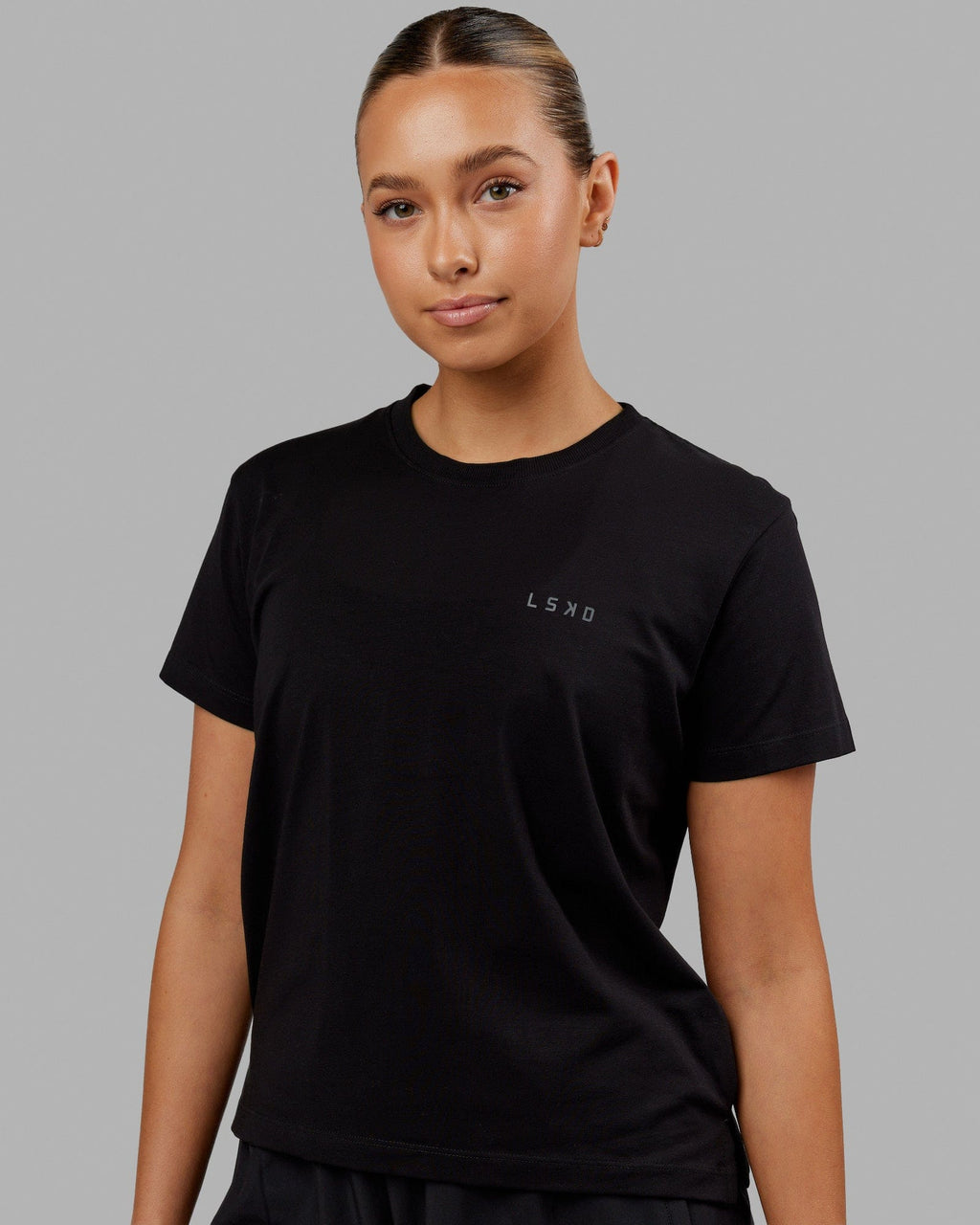 Woman wearing Deluxe PimaFLX Tee - Black
