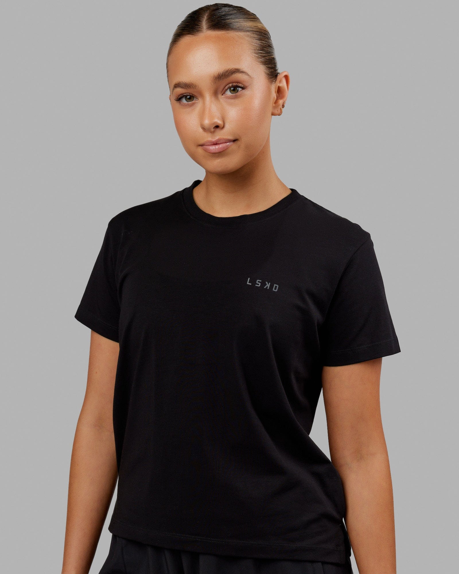 Woman wearing Deluxe PimaFLX Tee - Black