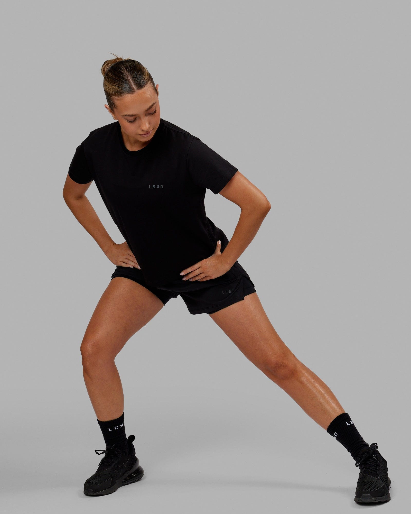 Woman wearing Deluxe PimaFLX Tee - Black