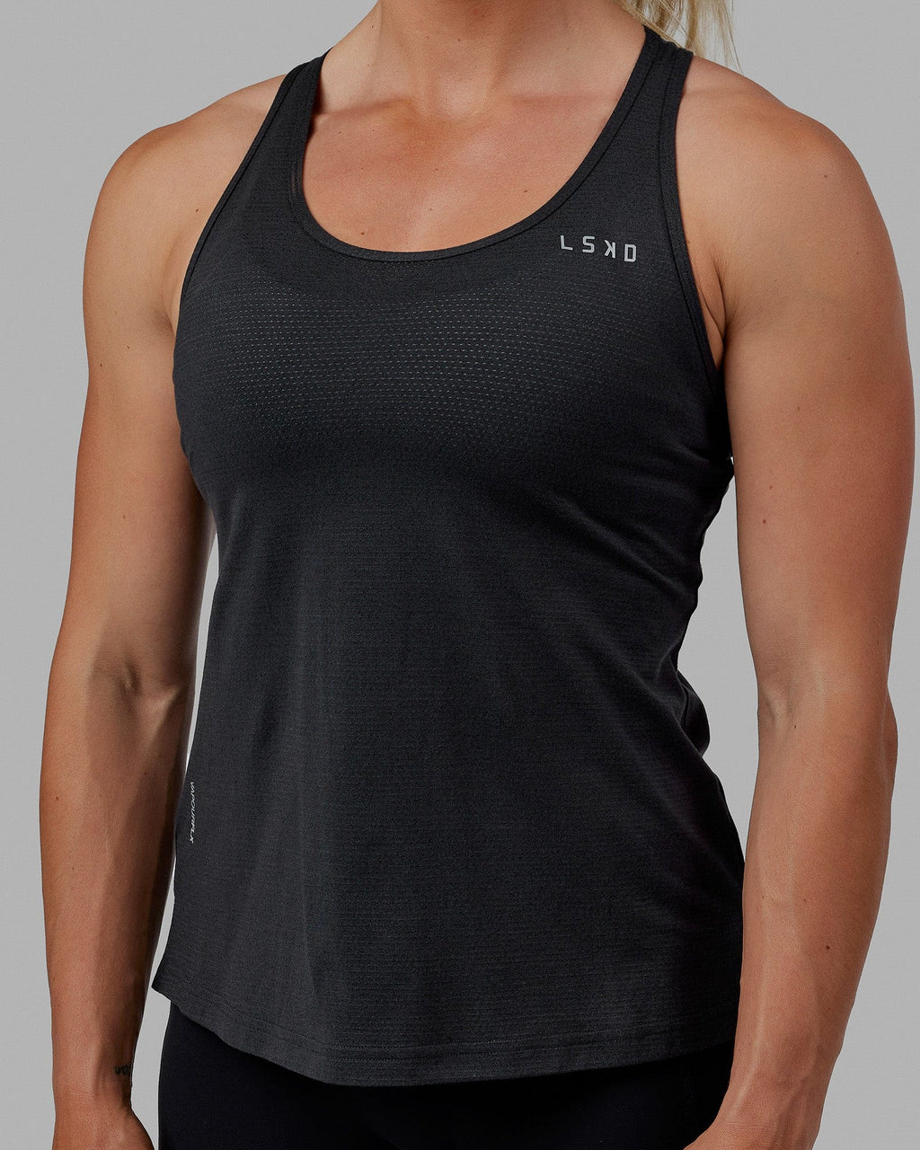 Woman wearing Perform VapourFLX Tank - Black Marl