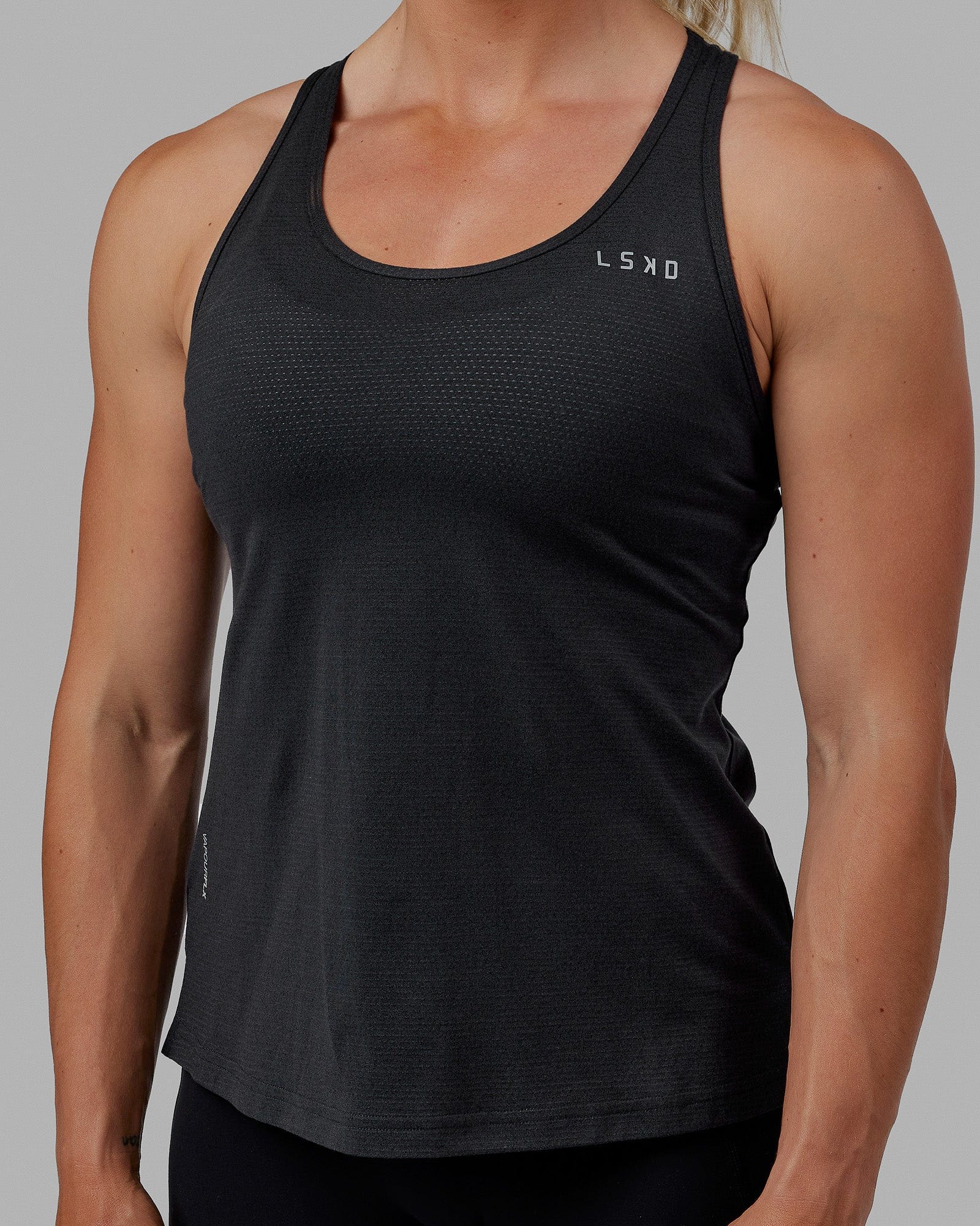 Woman wearing Perform VapourFLX Tank - Black Marl