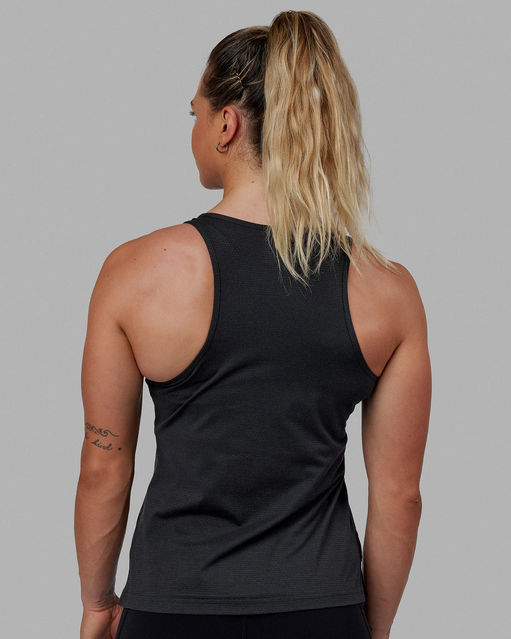 Woman wearing Perform VapourFLX Tank - Black Marl