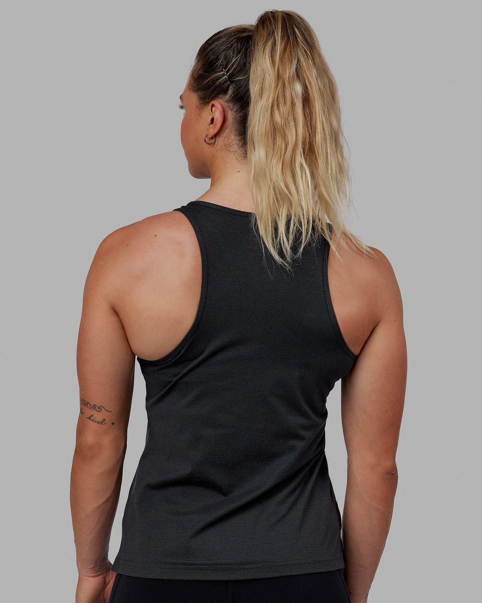 Woman wearing Perform VapourFLX Tank - Black Marl