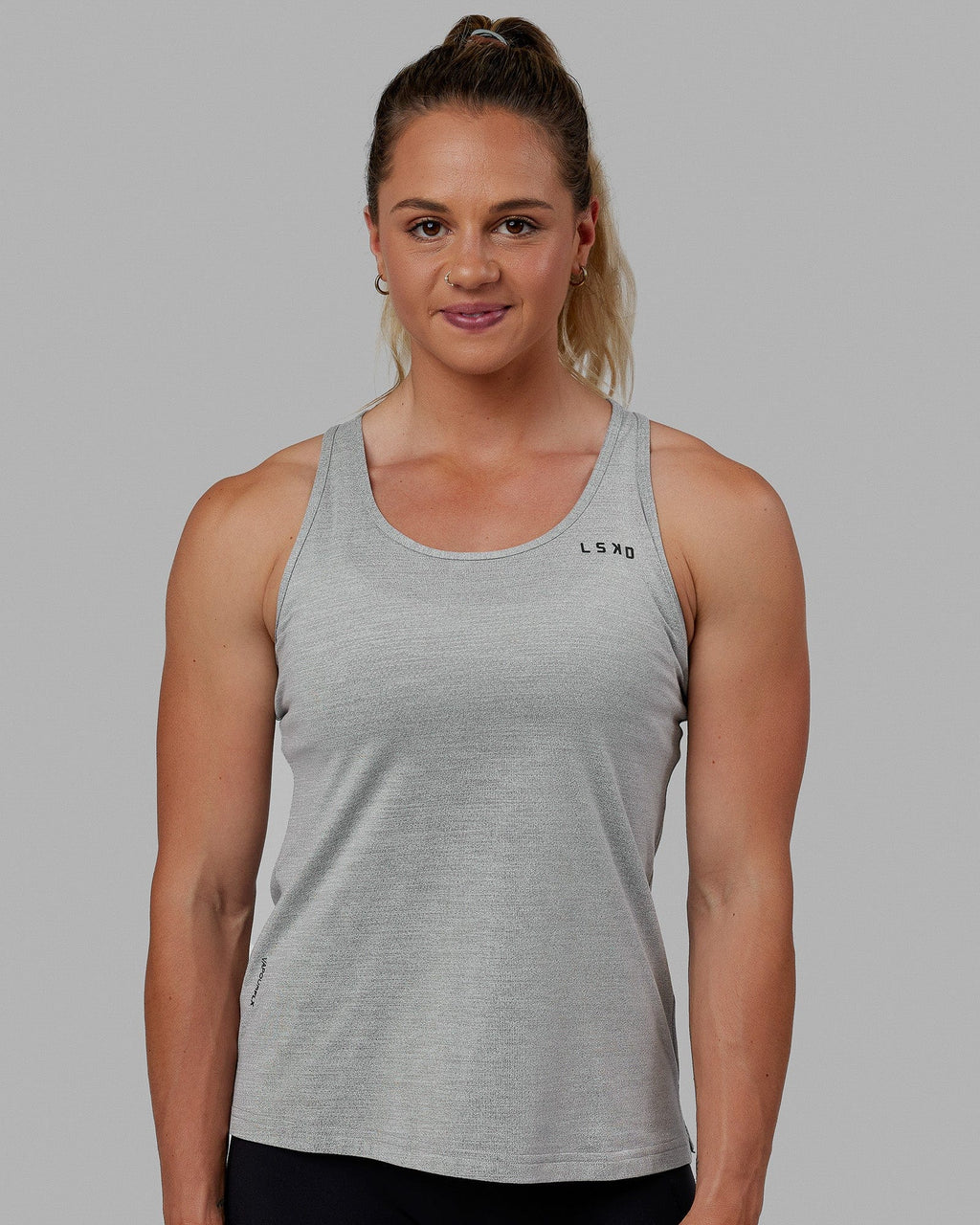 Woman wearing Perform VapourFLX Tank - Lt Grey Marl
