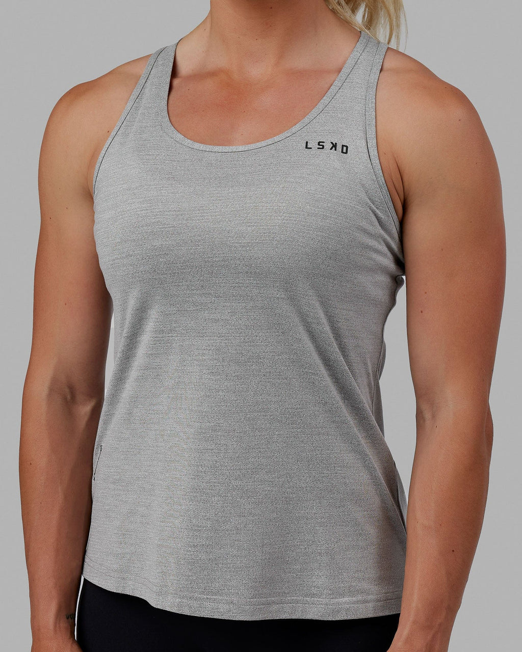 Woman wearing Perform VapourFLX Tank - Lt Grey Marl