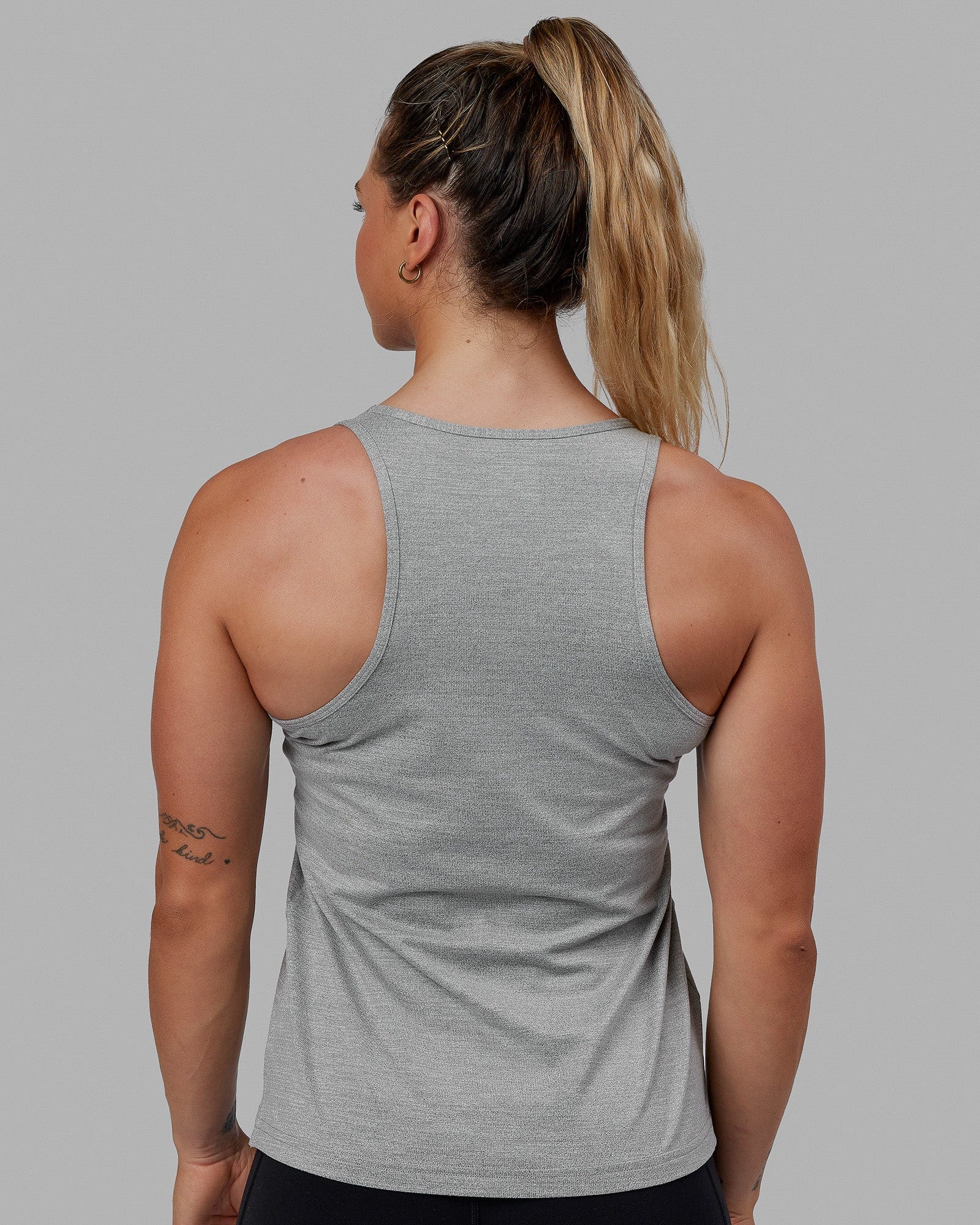 Woman wearing Perform VapourFLX Tank - Lt Grey Marl