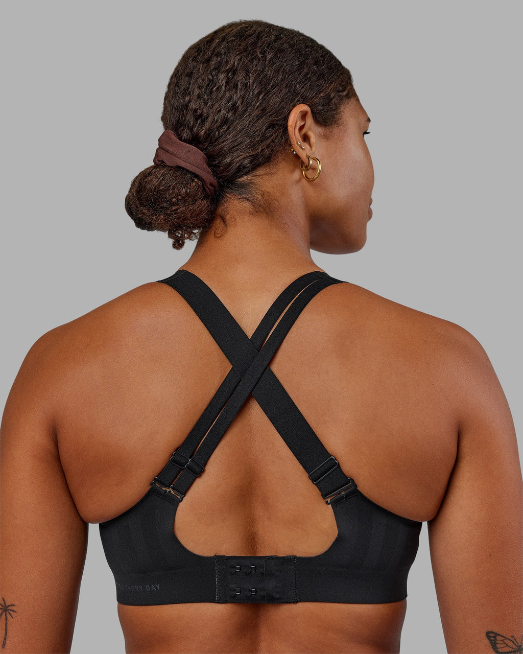Woman wearing Stability Sports Bra - Black | Model:Janet | Size:S (A-C Cup)