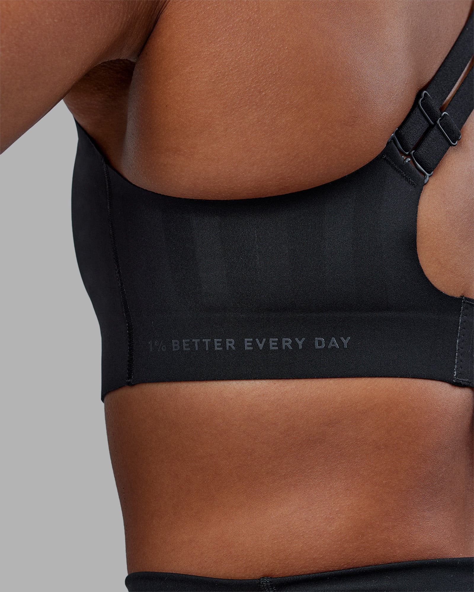 Woman wearing Stability Sports Bra - Black | Model:Janet | Size:S (A-C Cup)