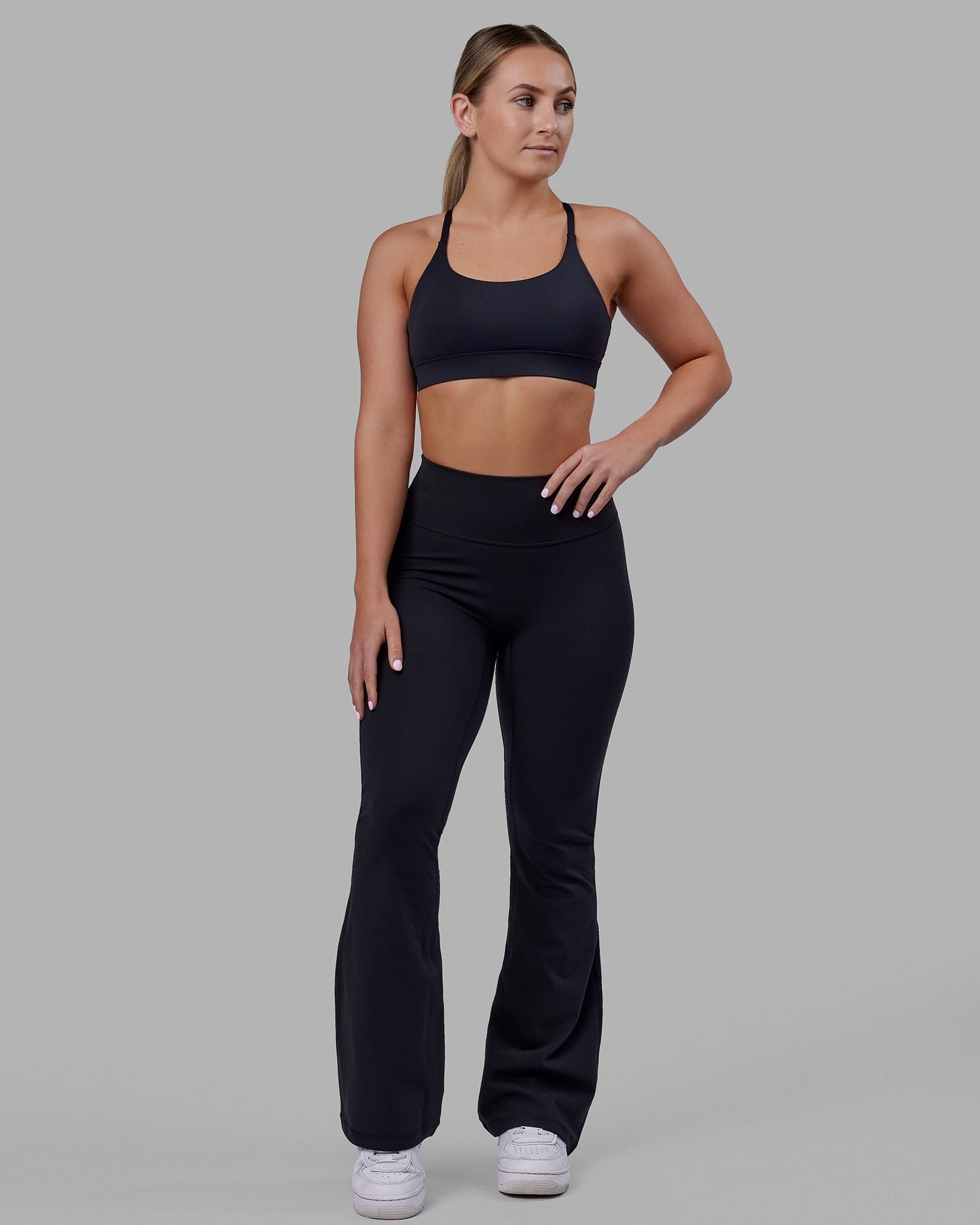 Woman wearing Everyday Flare Tight Petite - Black