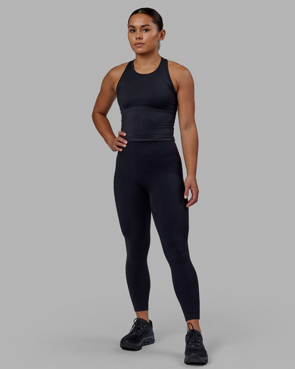Woman wearing Flow Performance Tank - Black