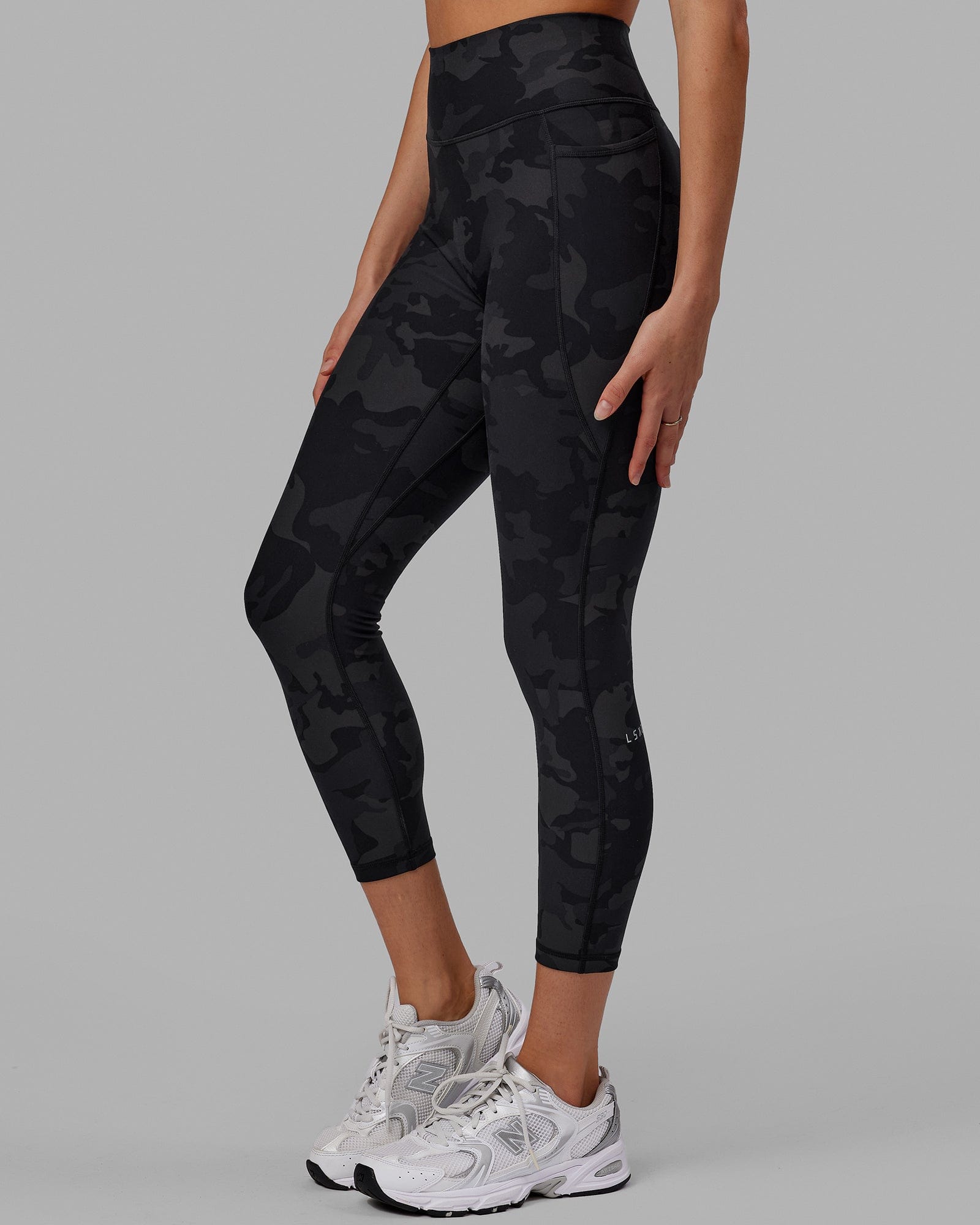 Woman wearing Fusion 7/8 Length Tight - Black-Camo
