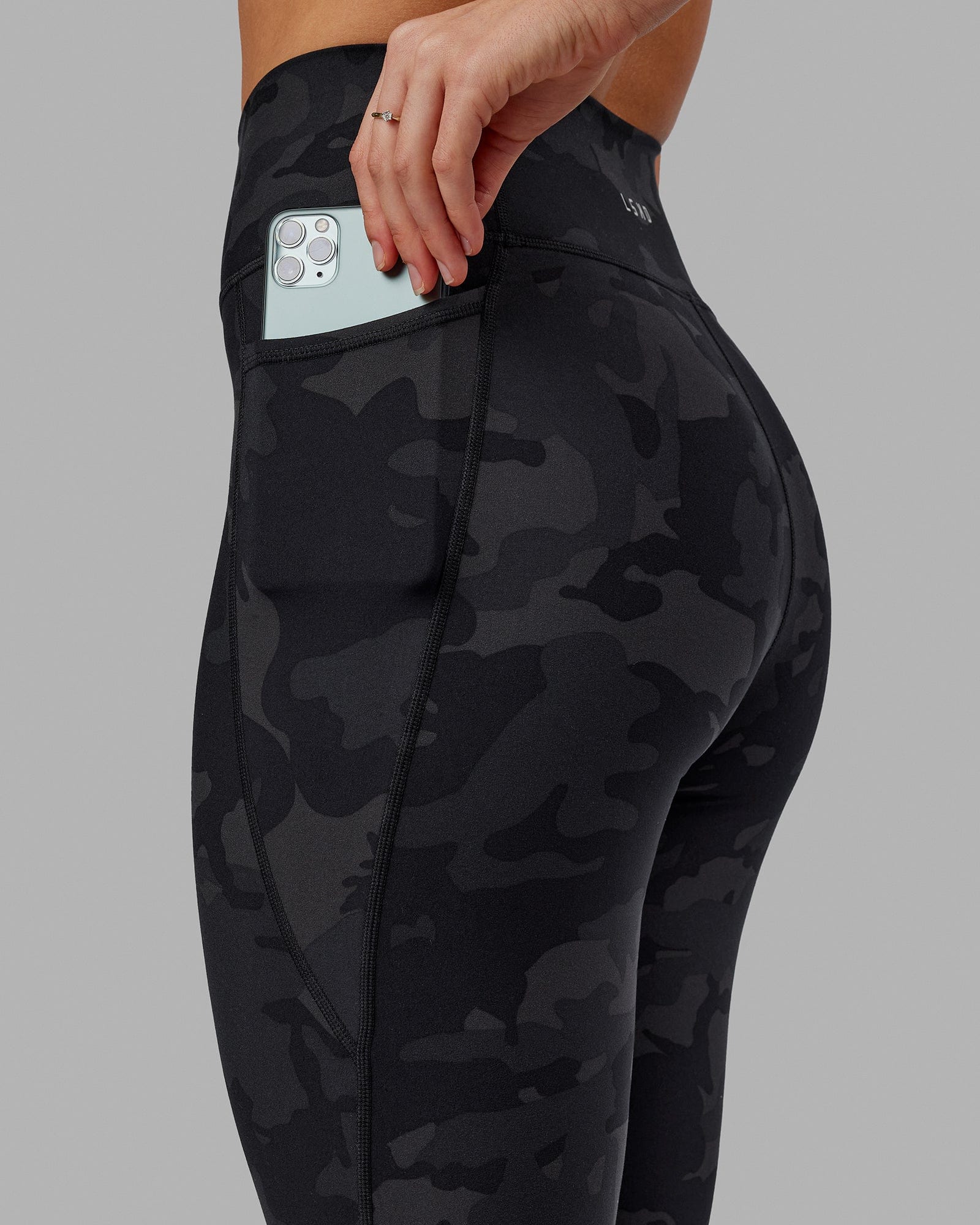 Woman wearing Fusion 7/8 Length Tight - Black-Camo