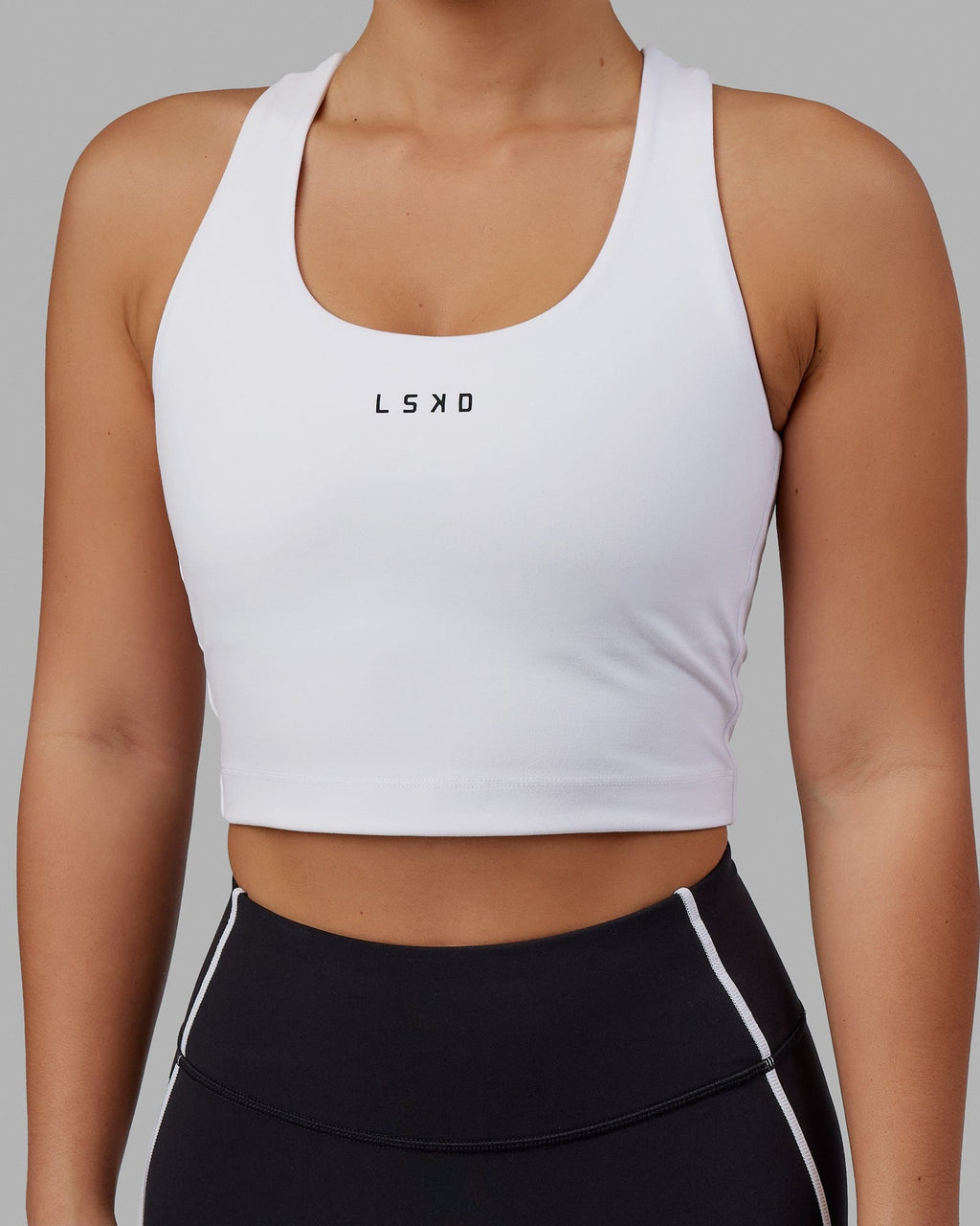 Woman wearing Pulse Active Tank - White