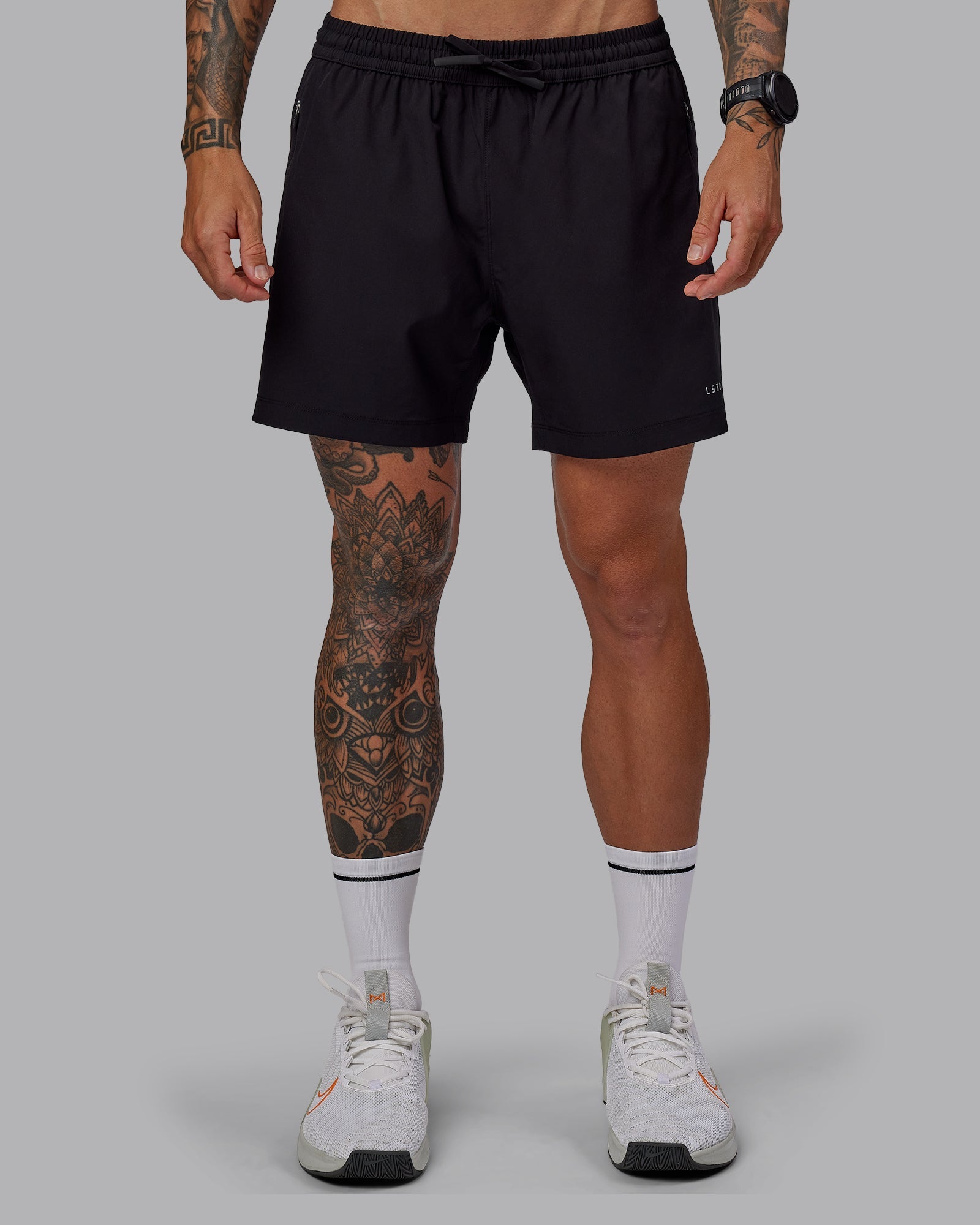 Man wearing Rep 5" Lined Performance Shorts in Black | Size:S