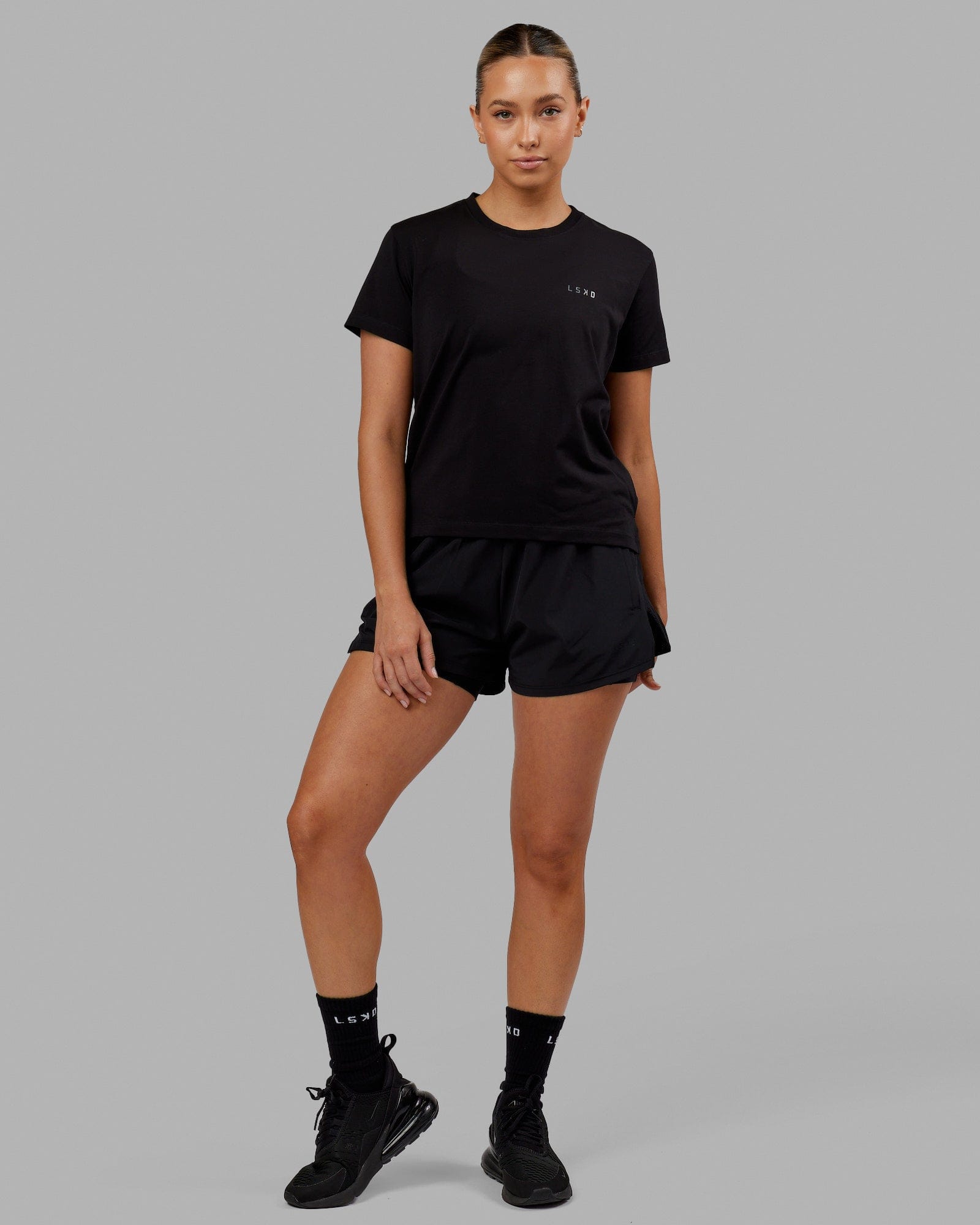 Woman wearing Deluxe PimaFLX Tee - Black