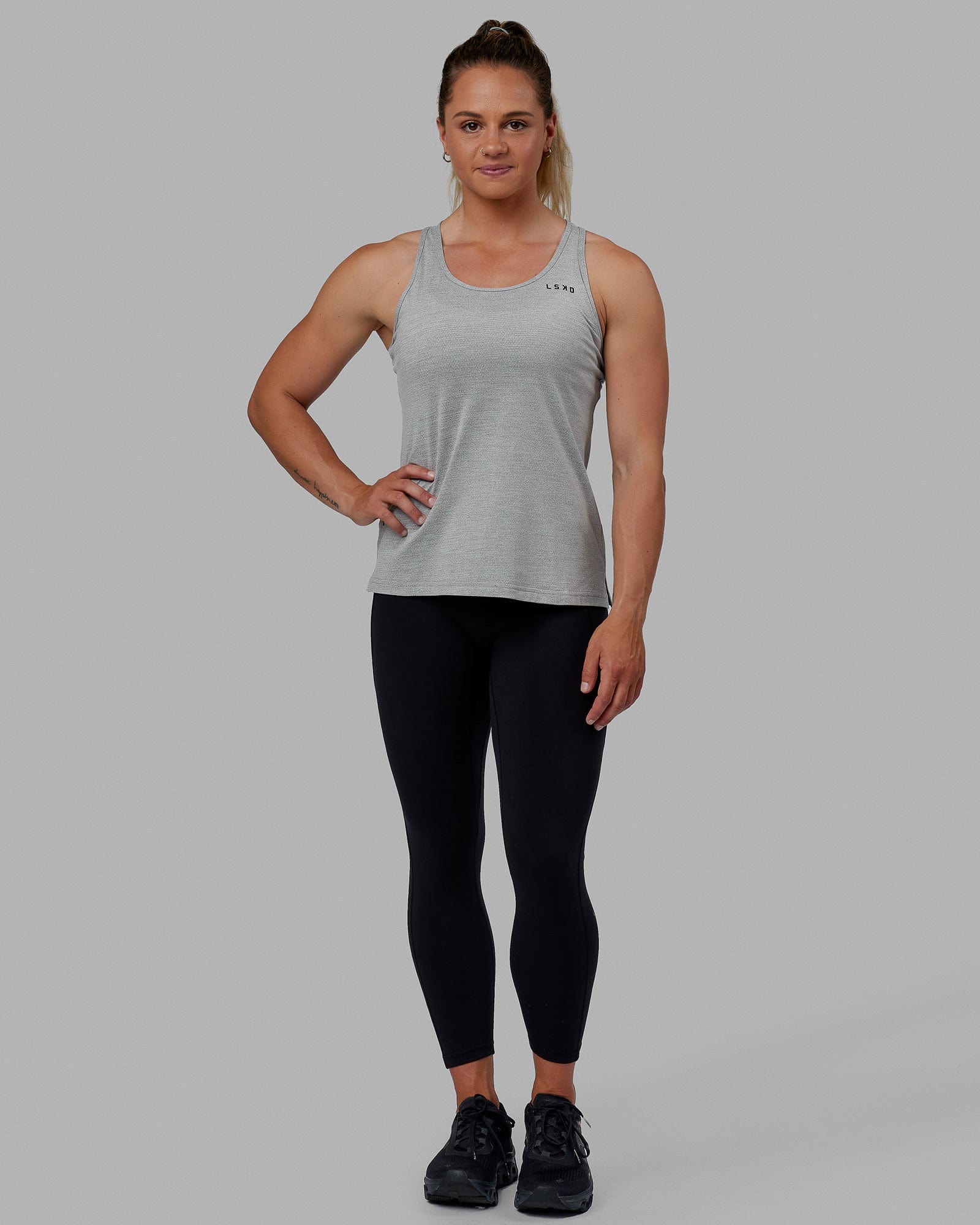 Woman wearing Perform VapourFLX Tank - Lt Grey Marl