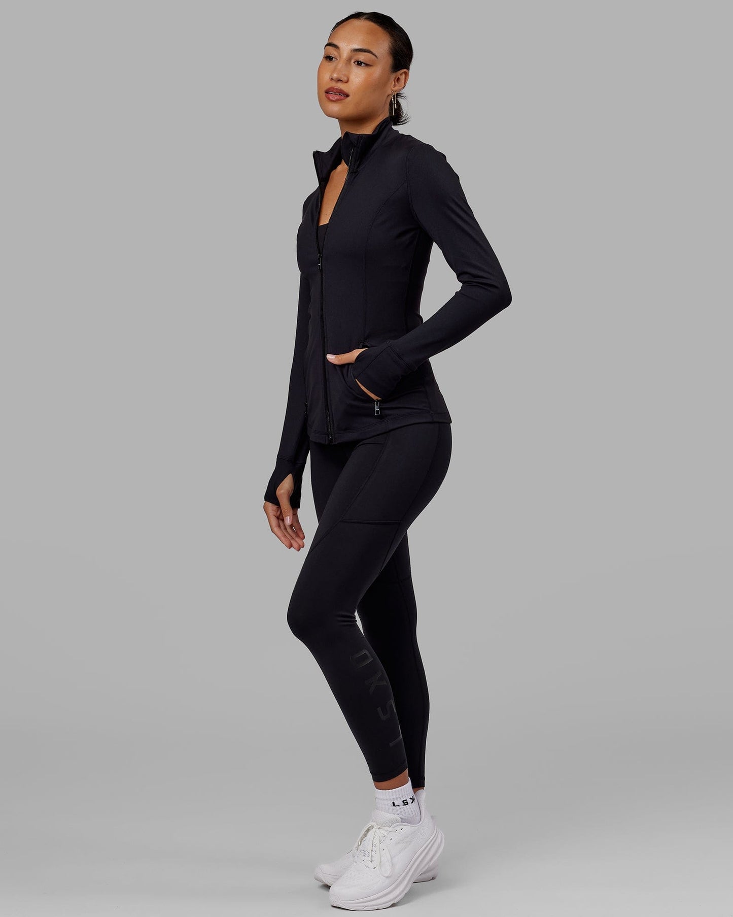 Woman wearing Stride Zip Through Jacket - Black