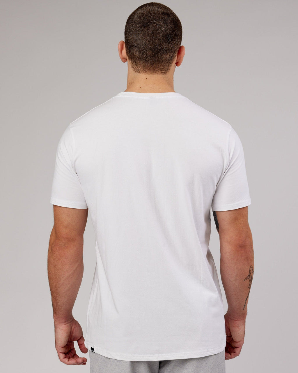 Man wearing Base FLXCotton Tee - White