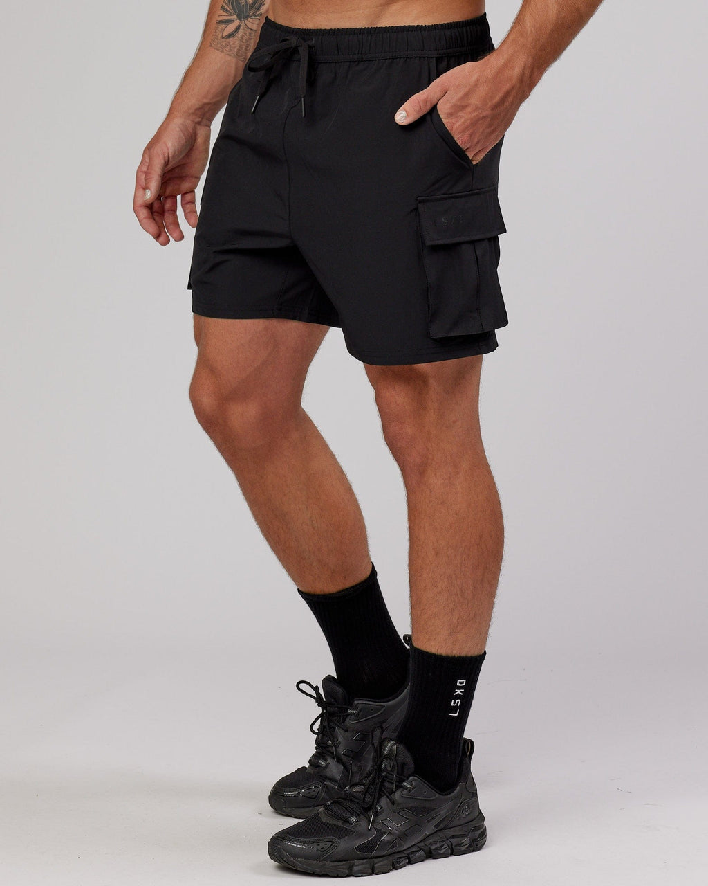 Man wearing Energy Stretch Performance Cargo Short - Black