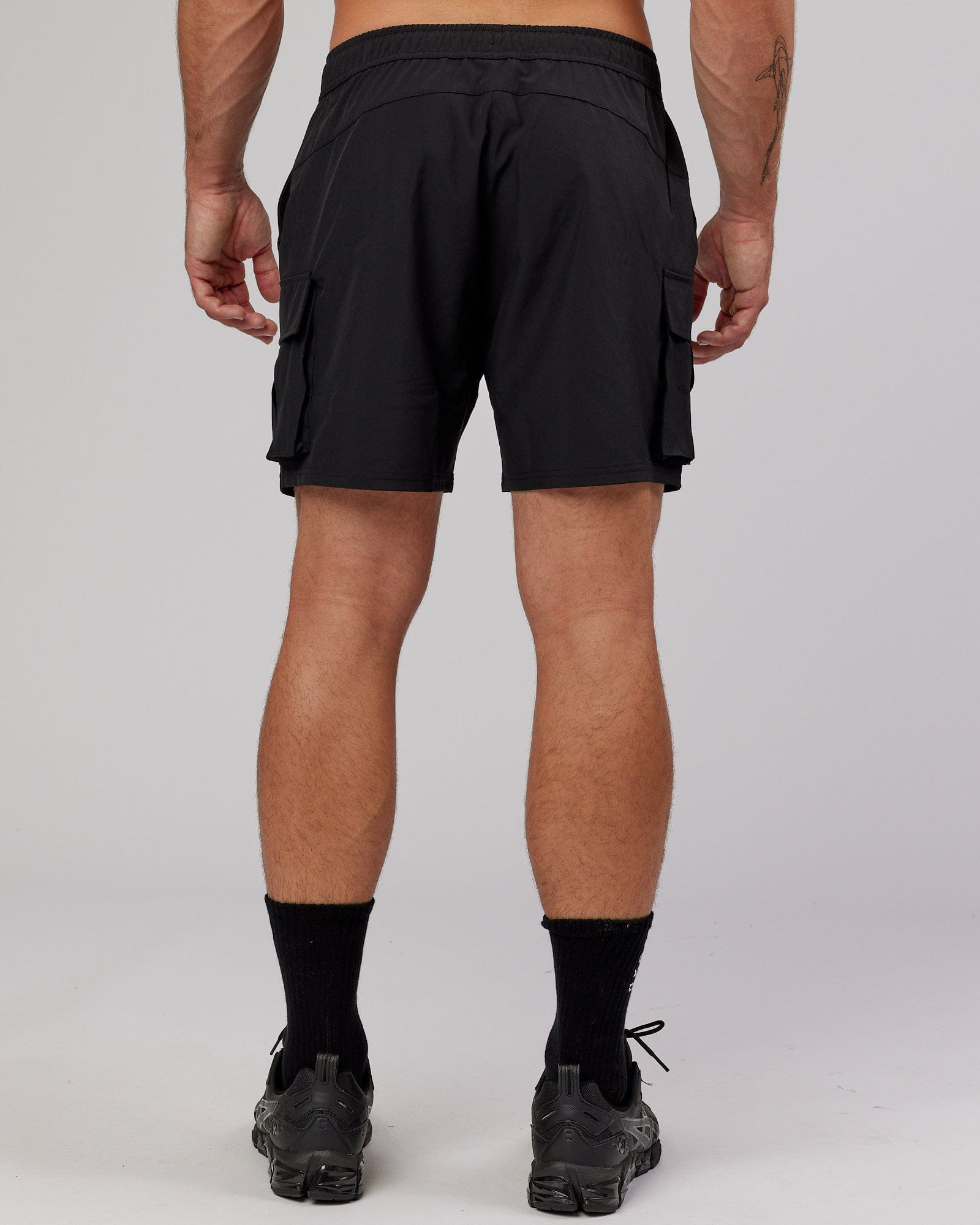 Man wearing Energy Stretch Performance Cargo Short - Black