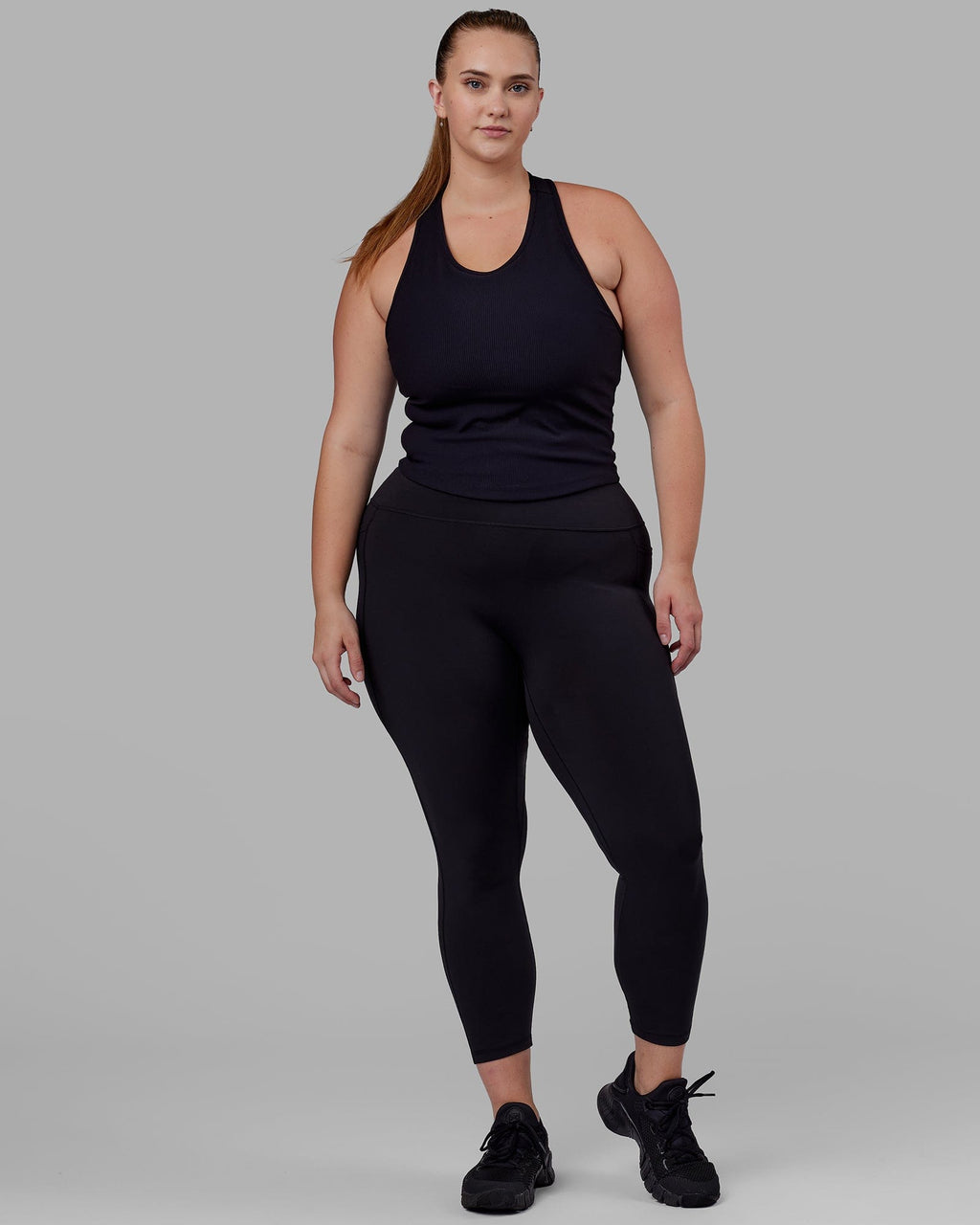 Woman wearing Flow Ribbed Shelf Bra Tank - Black