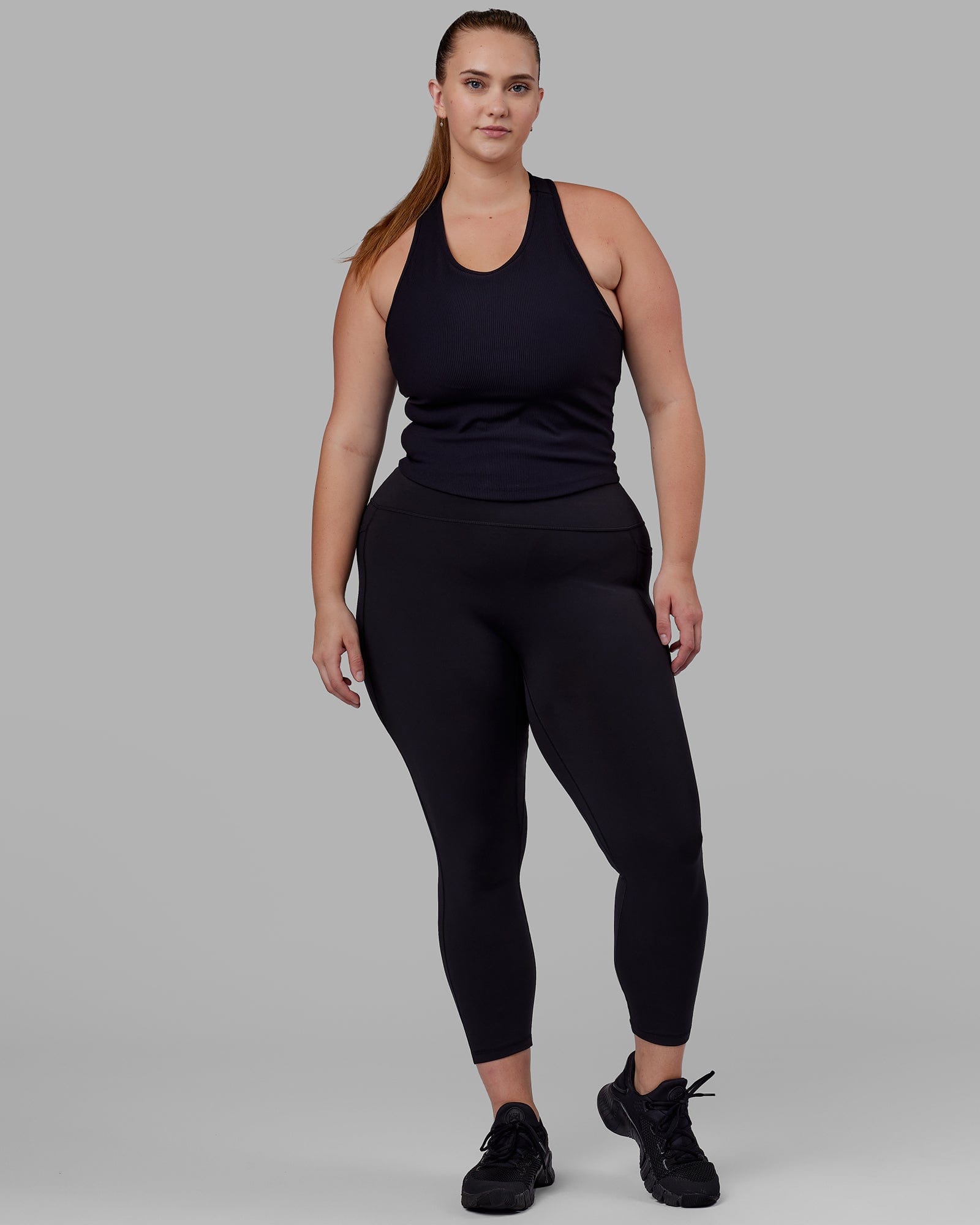 Woman wearing Flow Ribbed Shelf Bra Tank - Black