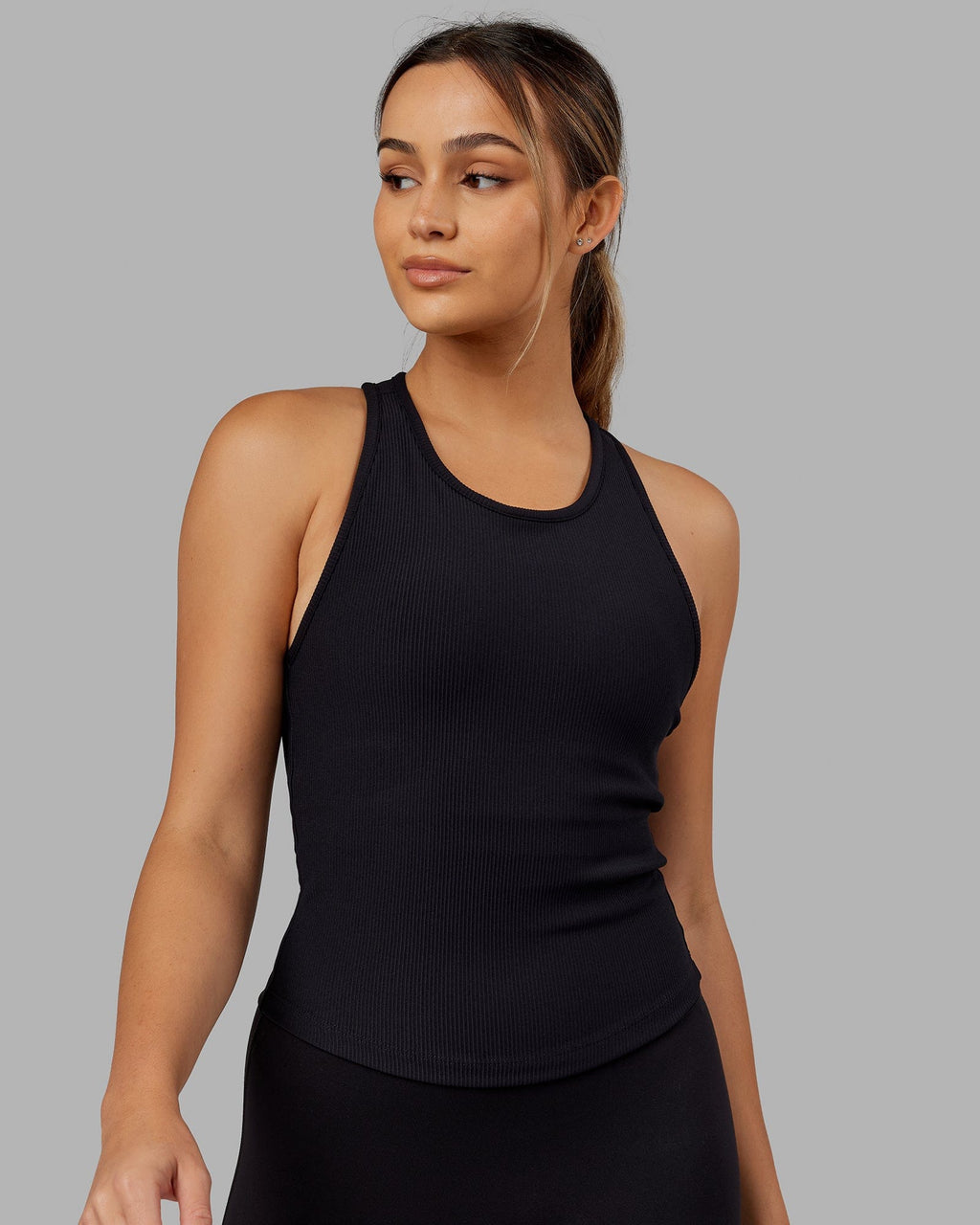 Woman wearing Flow Ribbed Shelf Bra Tank - Black