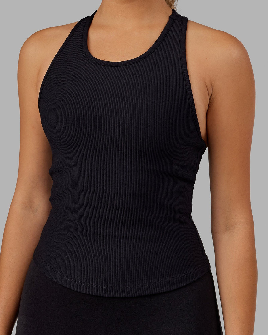 Woman wearing Flow Ribbed Shelf Bra Tank - Black