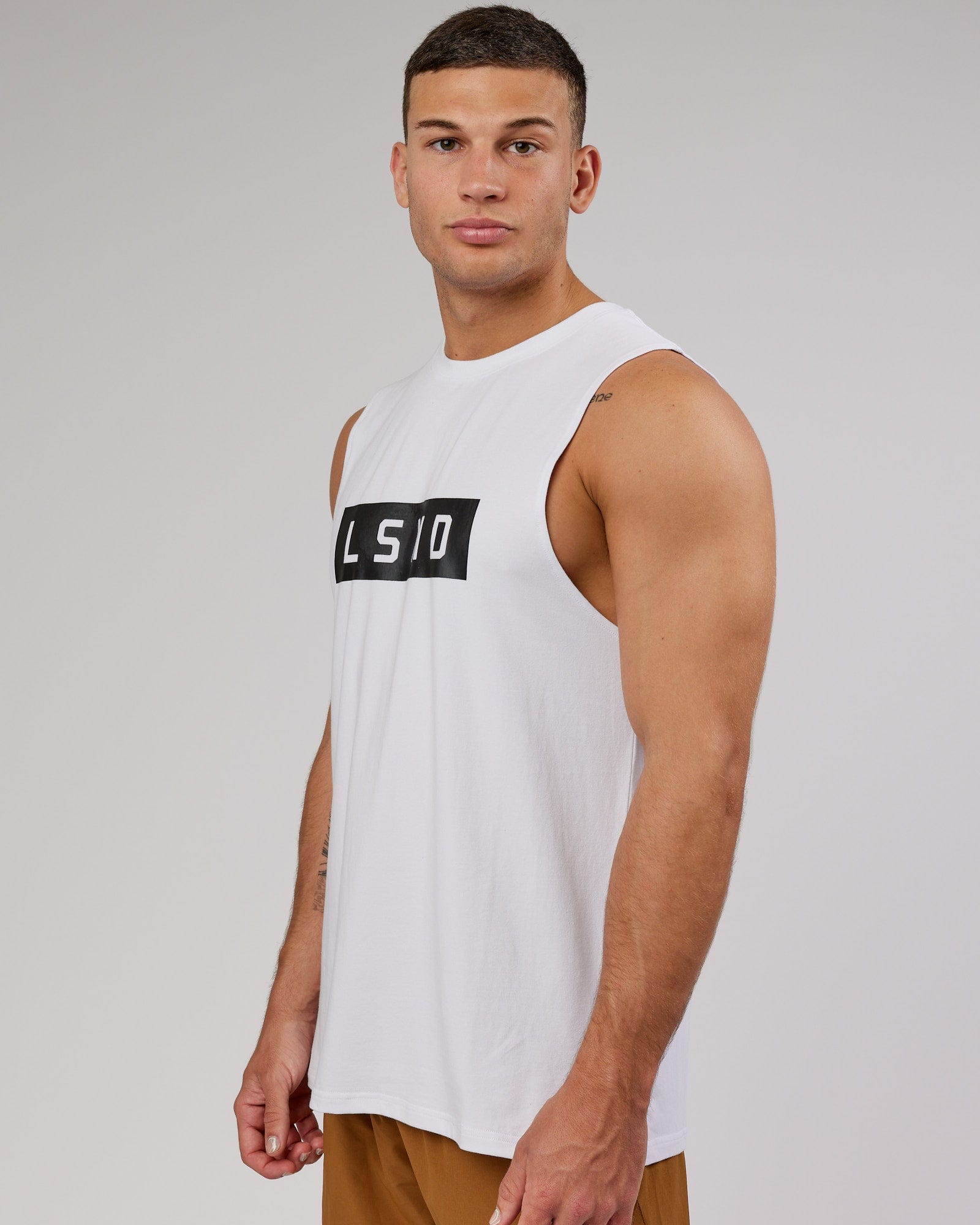 Man wearing Strength FLXCotton Training Fit Tank - White-Black