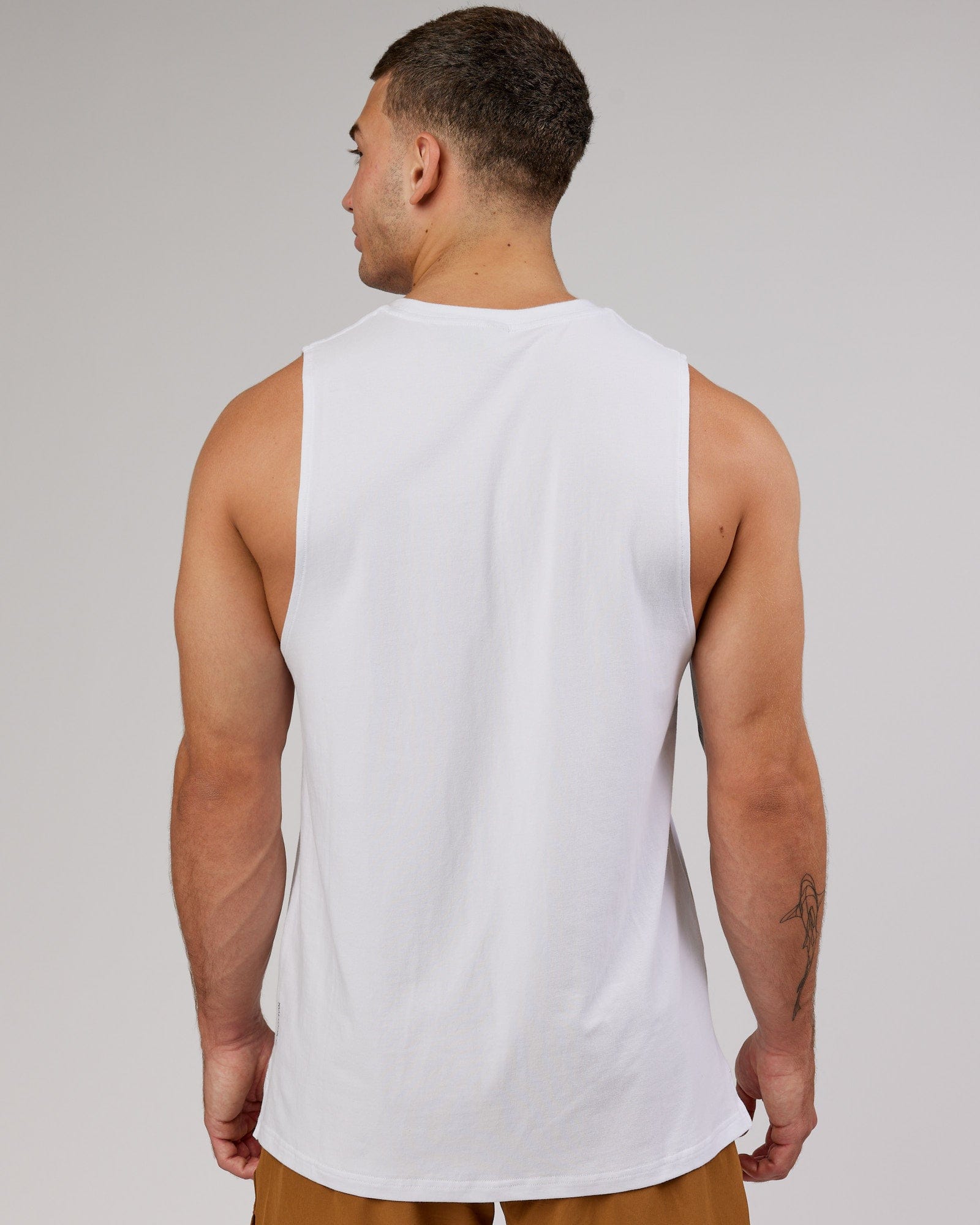 Man wearing Strength FLXCotton Training Fit Tank - White-Black