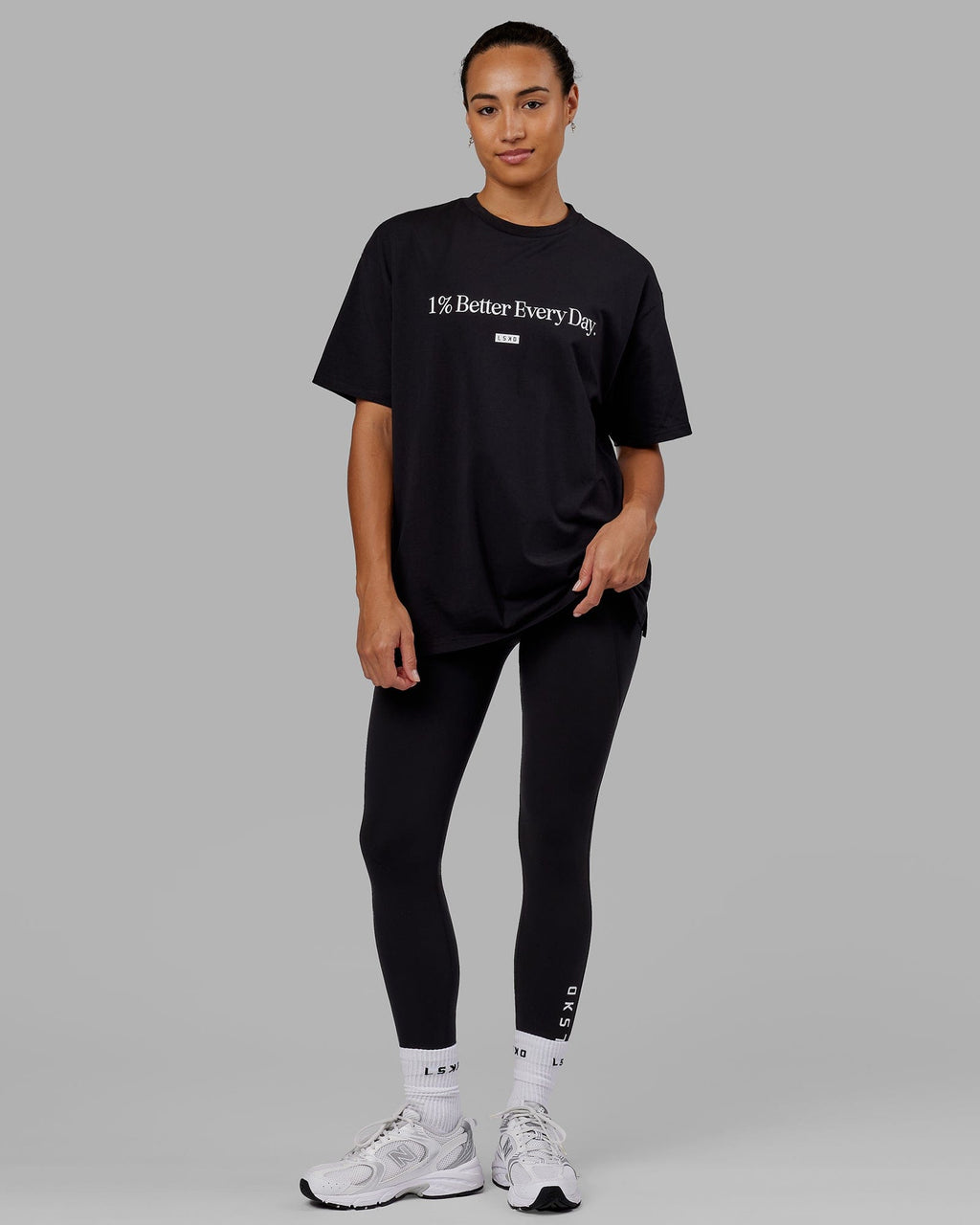Woman wearing Unisex 1% Better FLXCotton Tee Oversize - Black