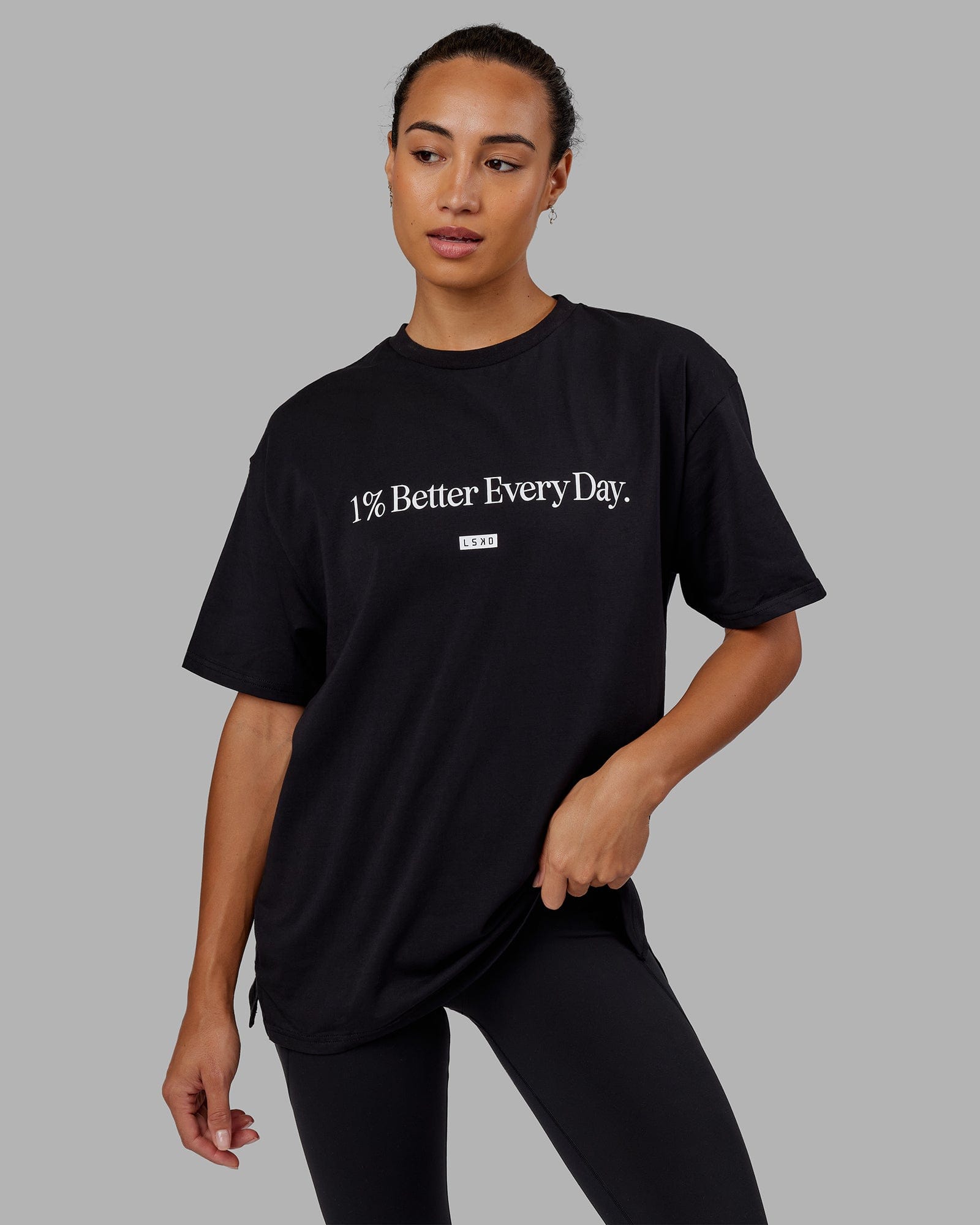 Woman wearing Unisex 1% Better FLXCotton Tee Oversize - Black