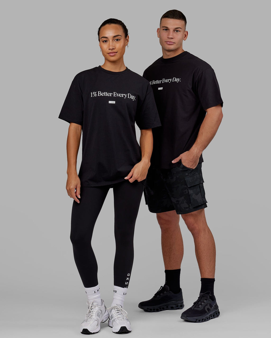 Man and Woman wearing Unisex 1% Better FLXCotton Tee Oversize - Black