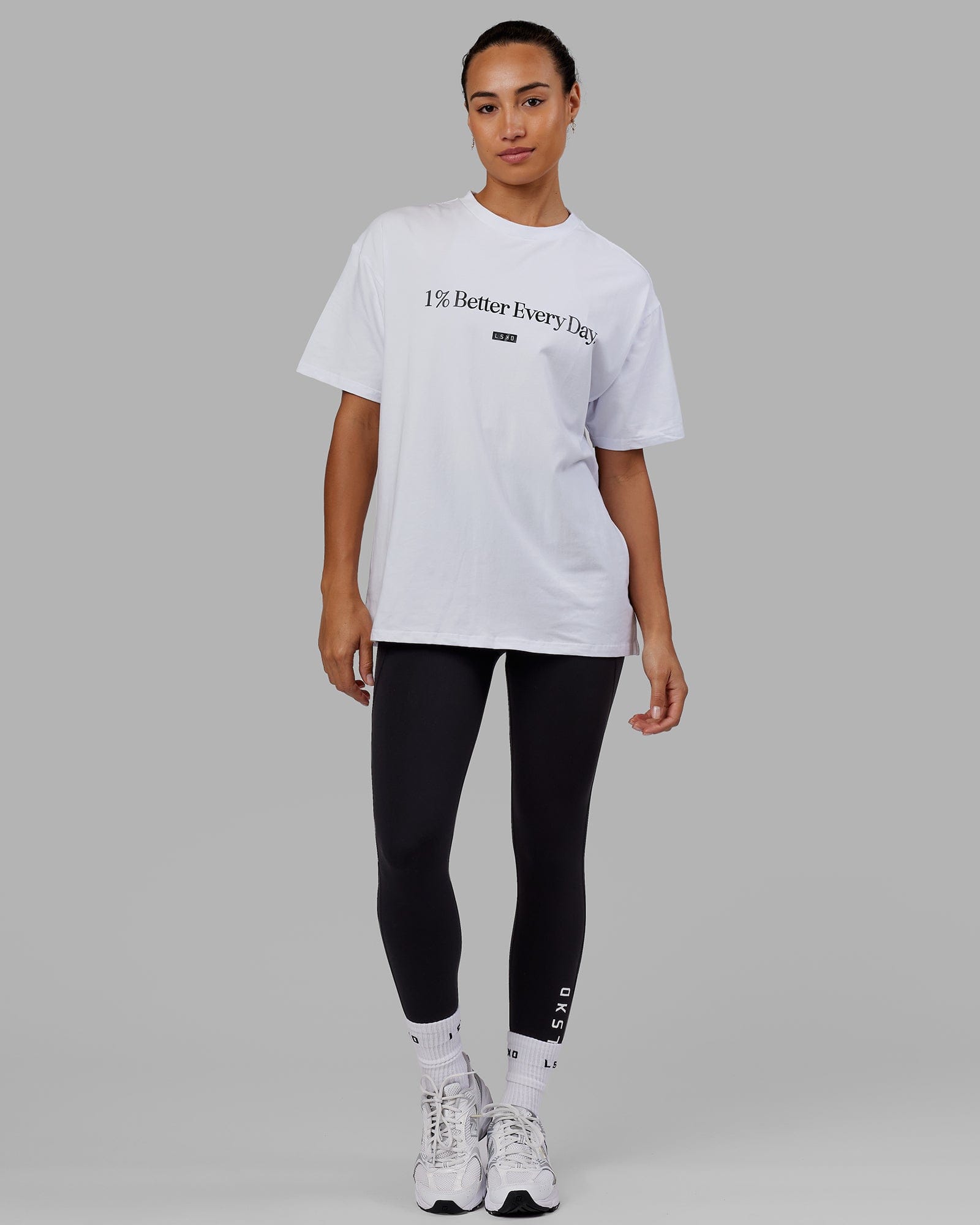 Woman wearing Unisex 1% Better FLXCotton Tee Oversize - White
