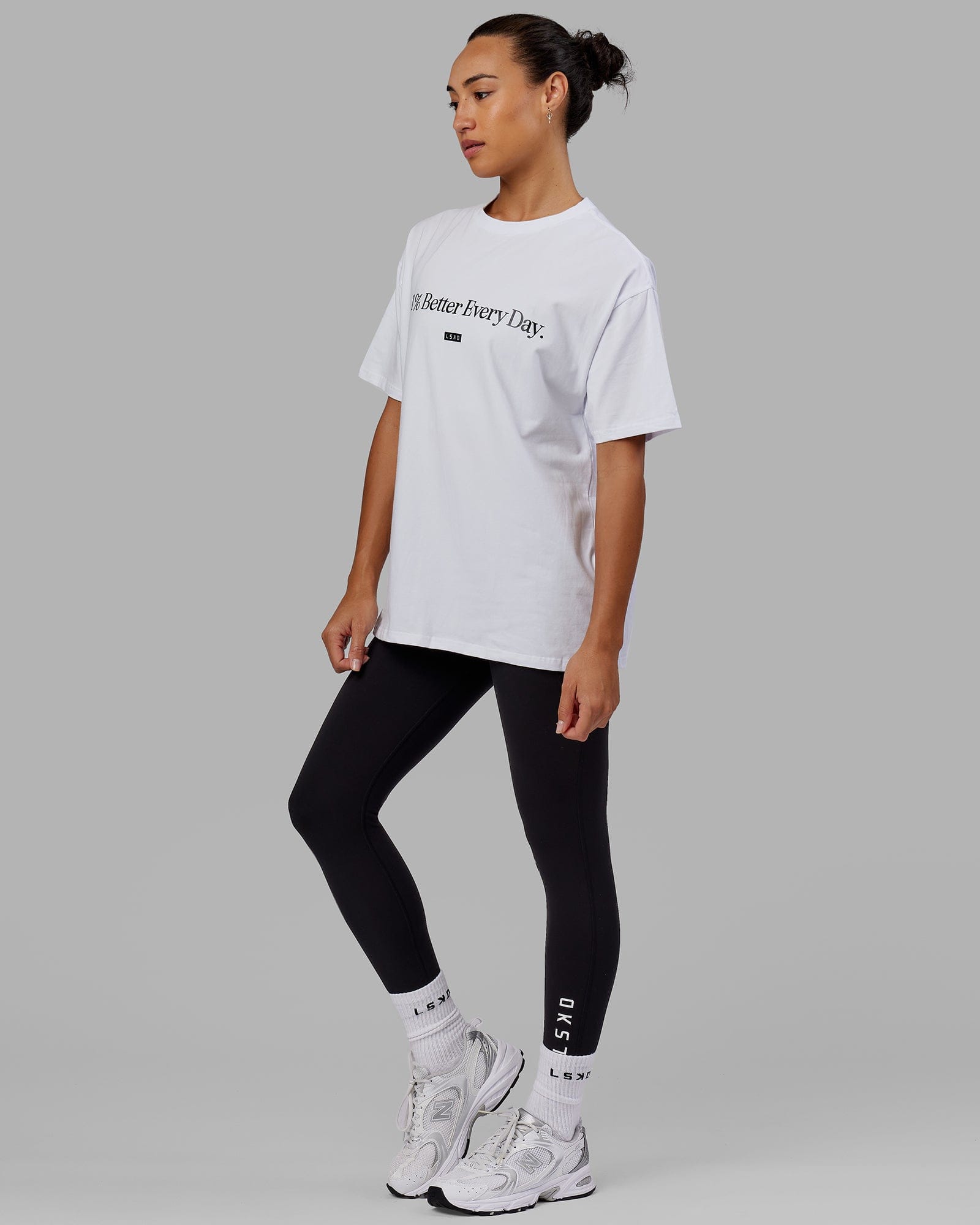 Woman wearing Unisex 1% Better FLXCotton Tee Oversize - White