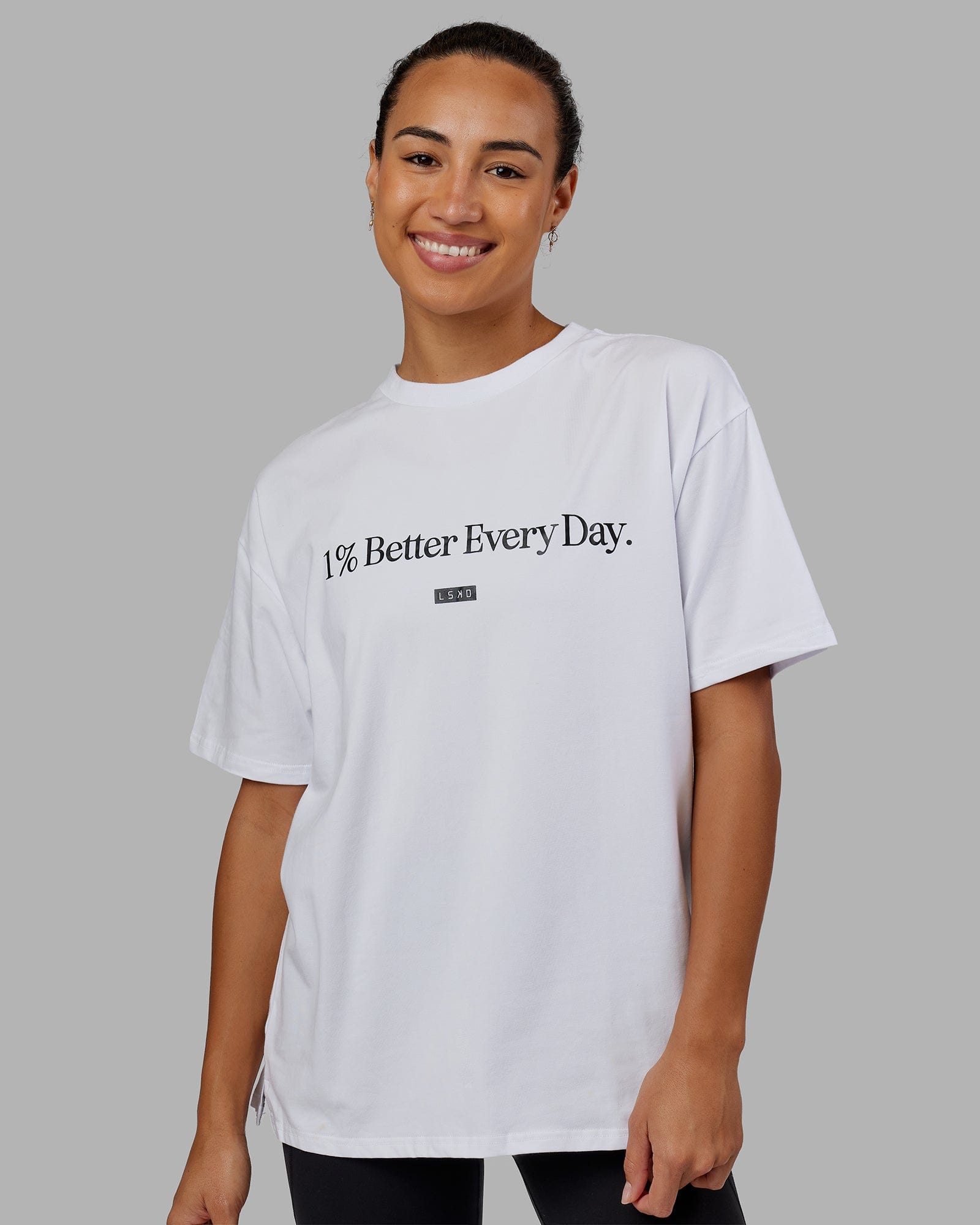 Woman wearing Unisex 1% Better FLXCotton Tee Oversize - White