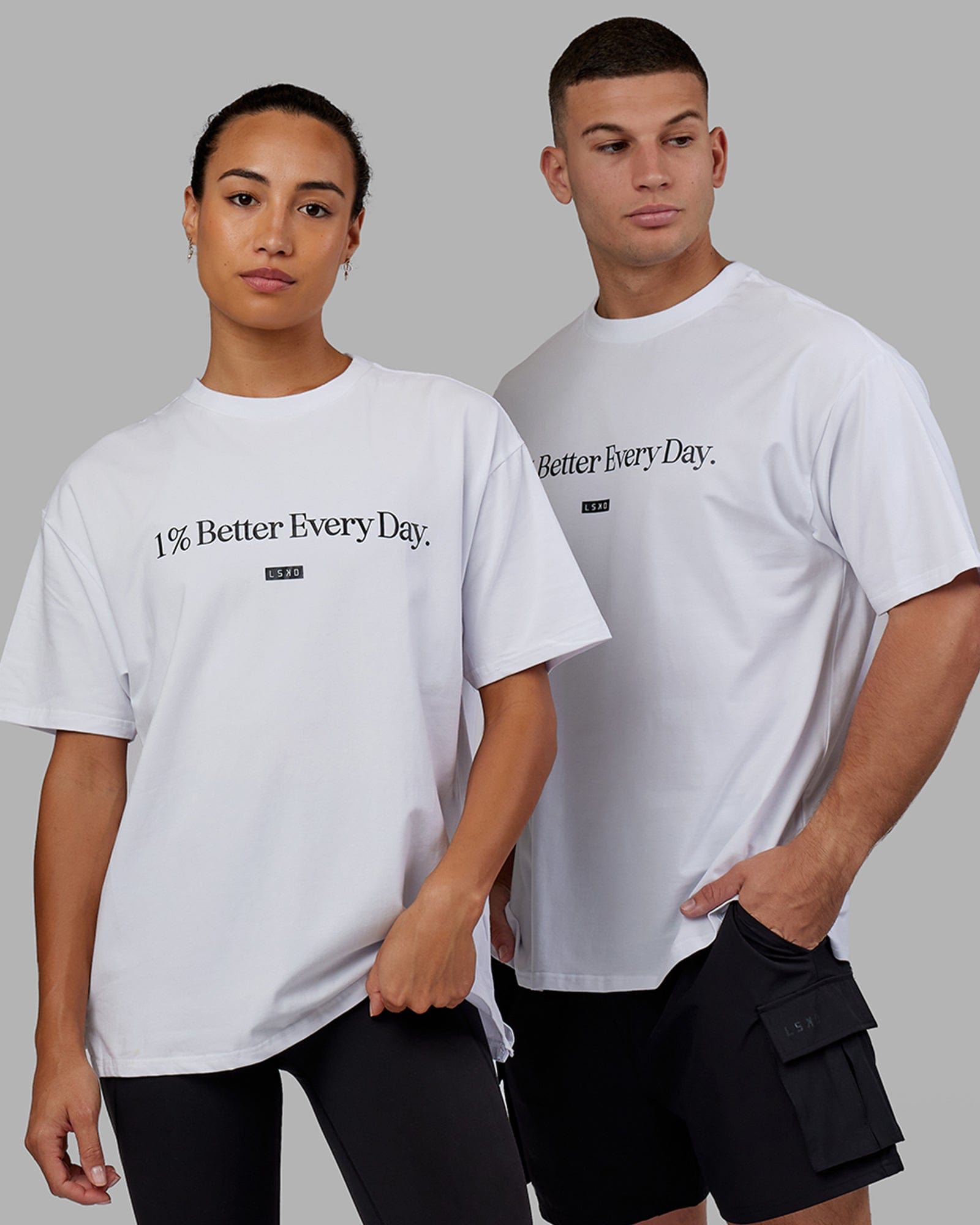 Man and Woman wearing Unisex 1% Better FLXCotton Tee Oversize - White