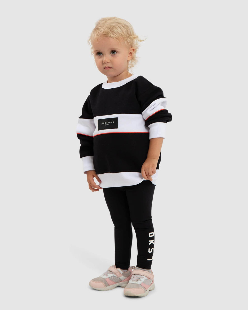 Model wearing Overtime Sweater (00-8) - Black-White-Fruit Punch