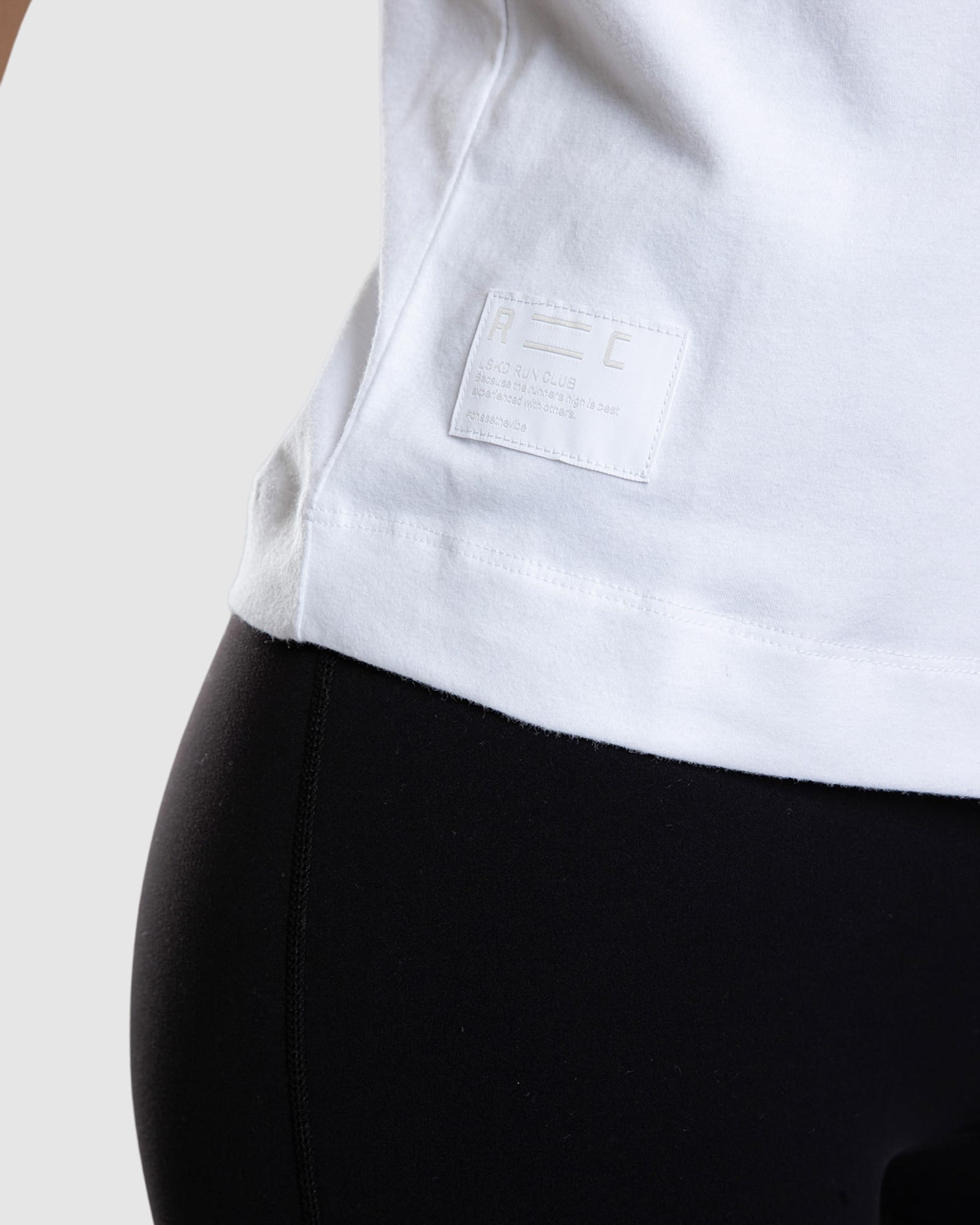 Model wearing Run Club FLXDRY Performance Tee - White-Reflective